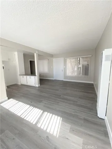 a bathroom with a toilet a sink a mirror and bathtub