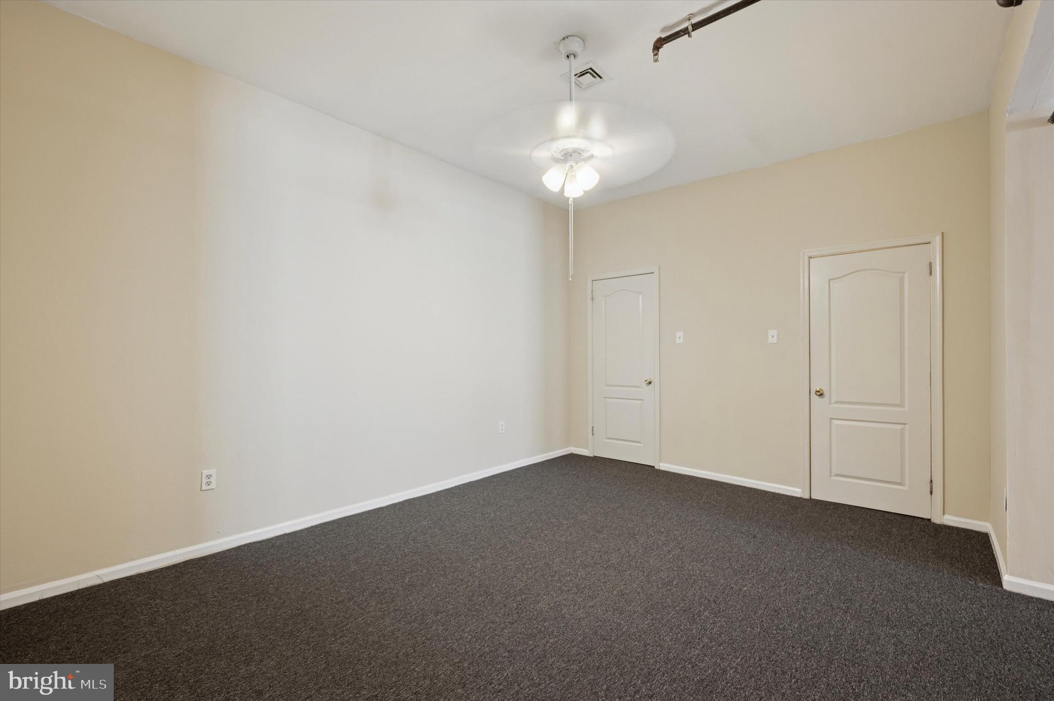 128 North 3rd Street, Unit 2R Philadelphia, PA 19106 - Photo 13 of 16 an empty room with a chandelier fan