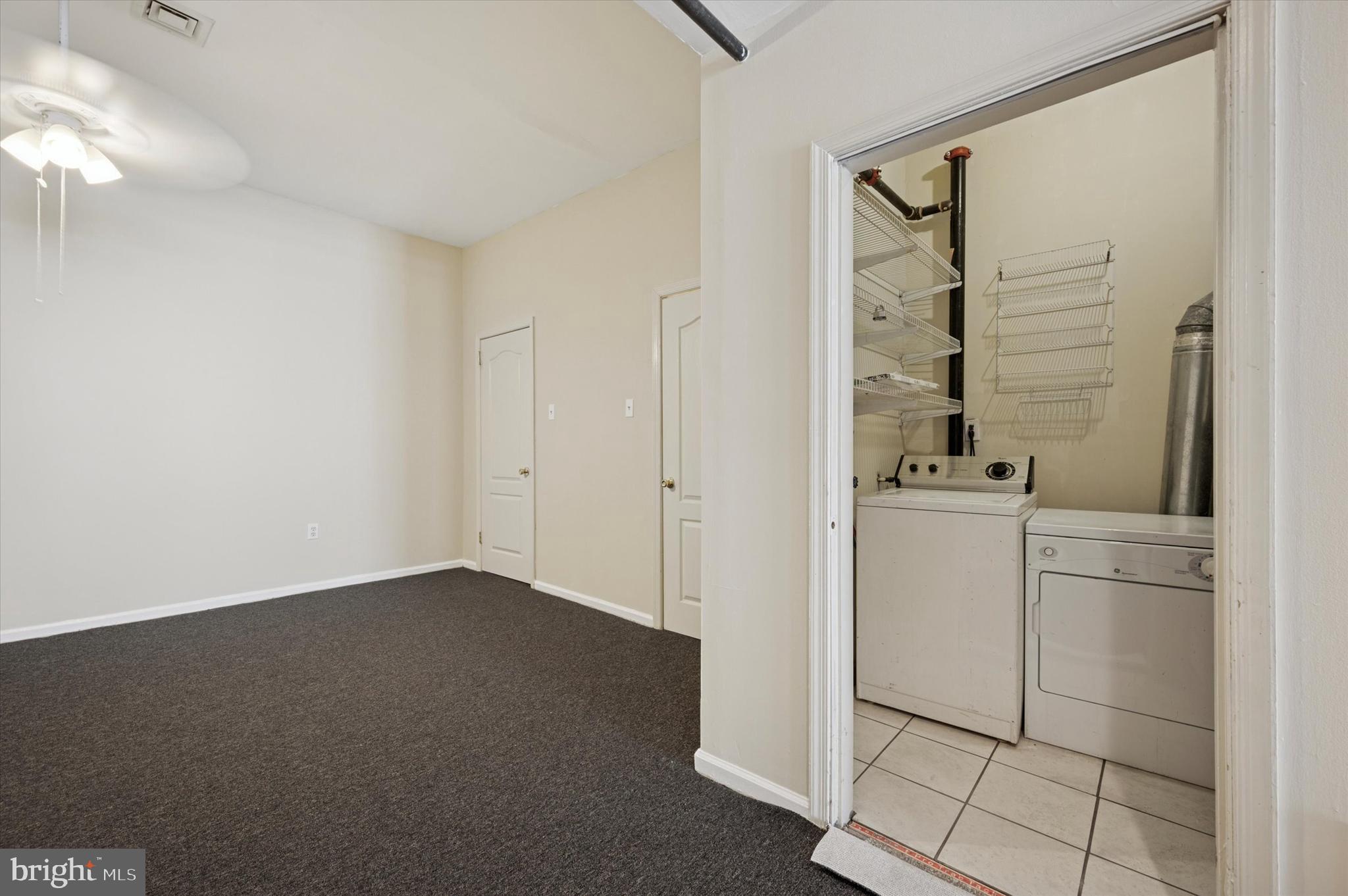 128 North 3rd Street, Unit 2R Philadelphia, PA 19106 - Photo 14 of 16 a room with a refrigerator and a sink