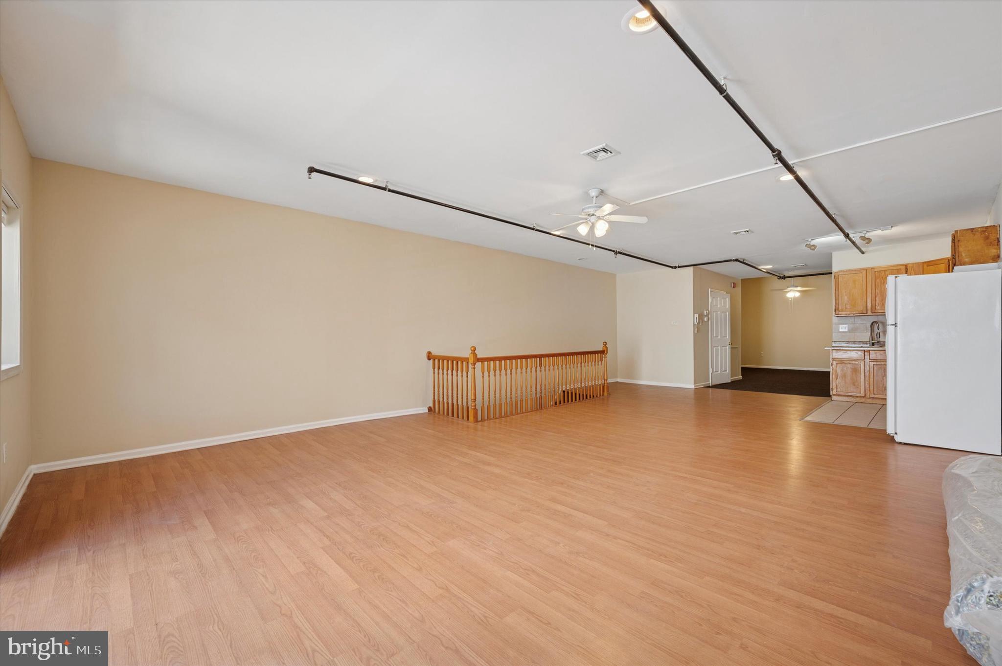 128 North 3rd Street, Unit 2R Philadelphia, PA 19106 - Photo 8 of 16 a view of a livingroom with a ceiling fan and window