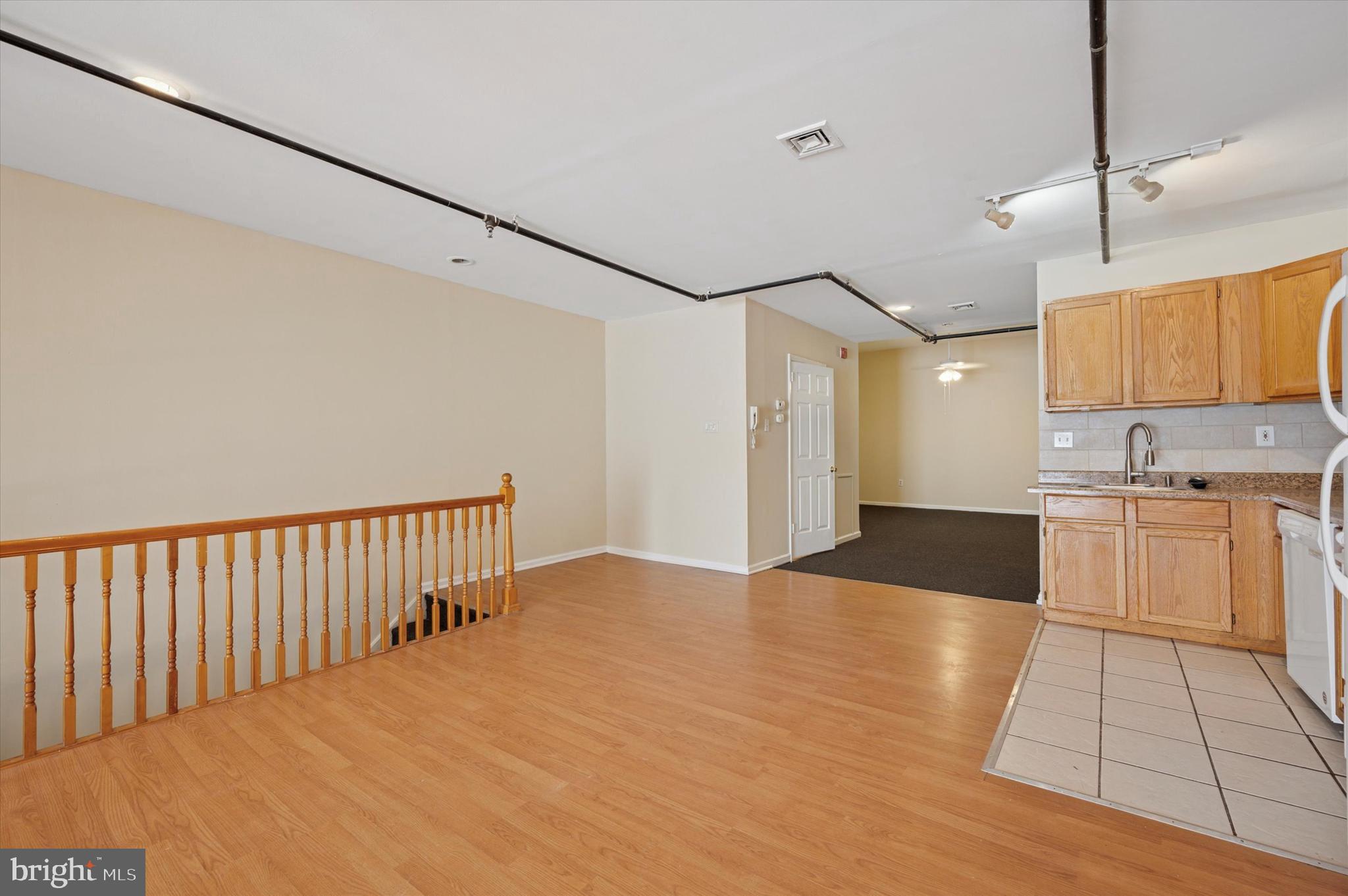 128 North 3rd Street, Unit 2R Philadelphia, PA 19106 - Photo 9 of 16 a view of a kitchen with wooden floor