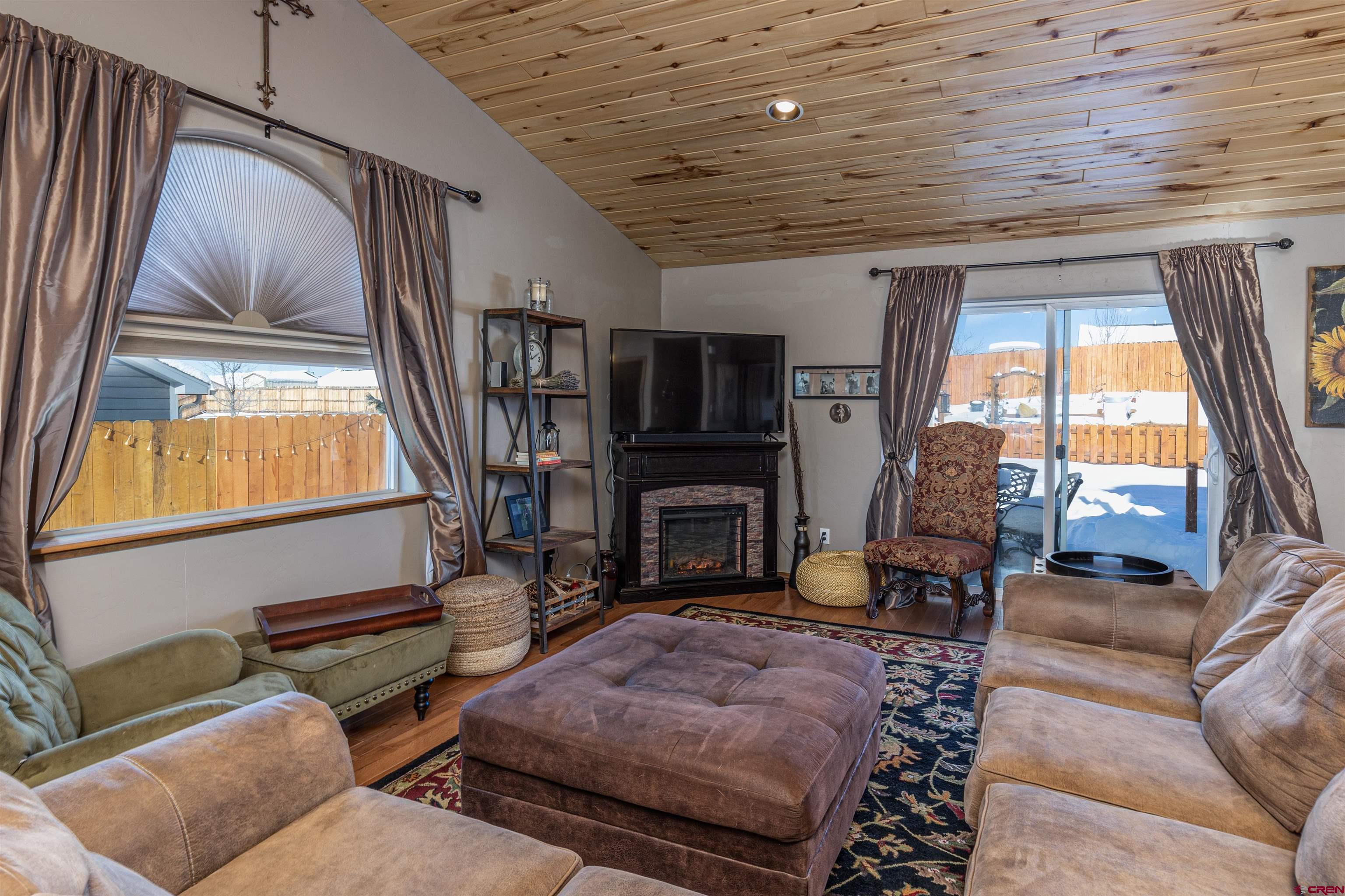 809 Hickory Ridge Bayfield, CO 81122 - Photo 3 of 24 a bedroom with furniture and a fireplace