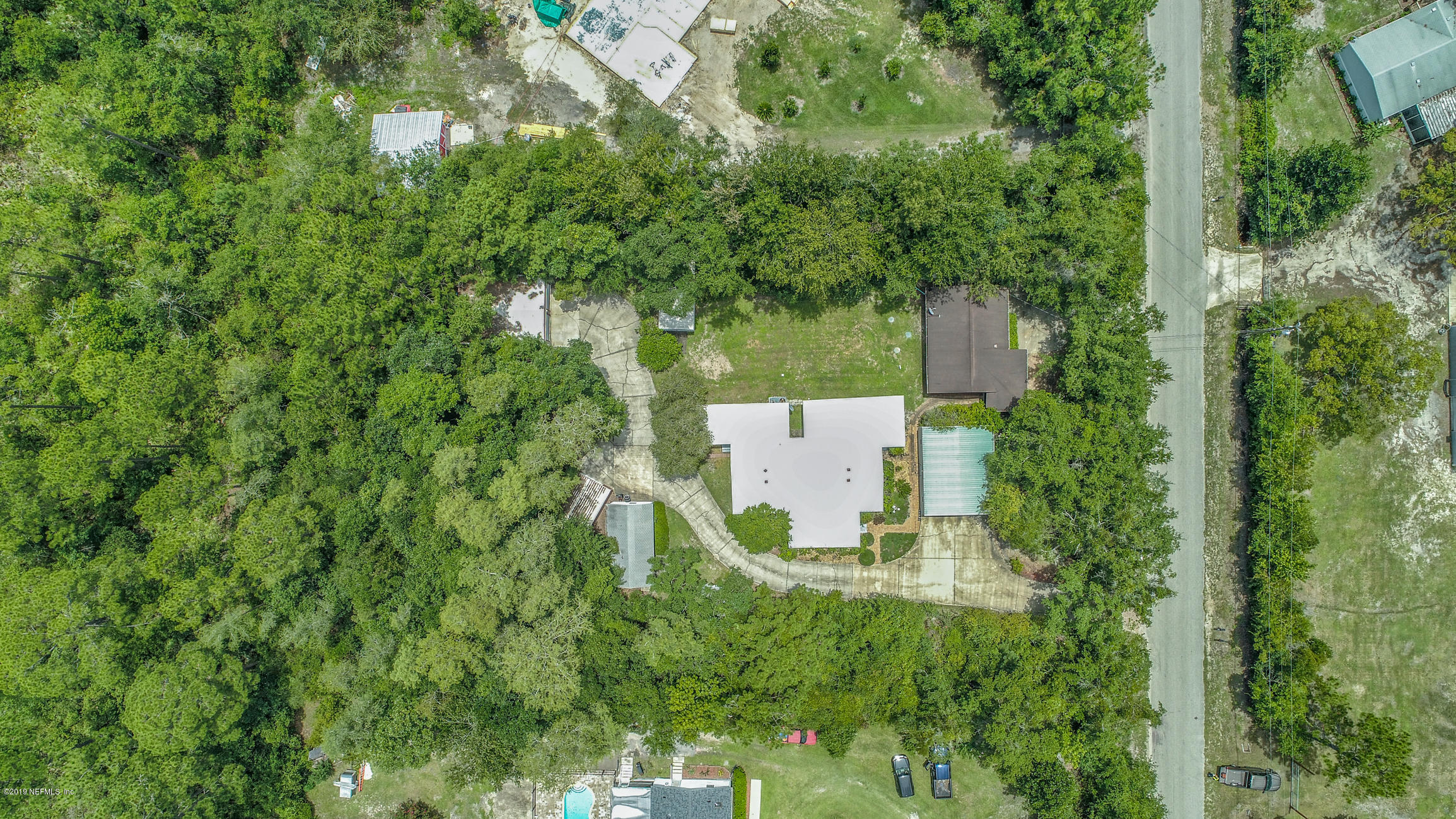 1665 Scott Road St. Johns, FL 32259 - Photo 1 of 54 an aerial view of a house with pool outdoor seating and yard