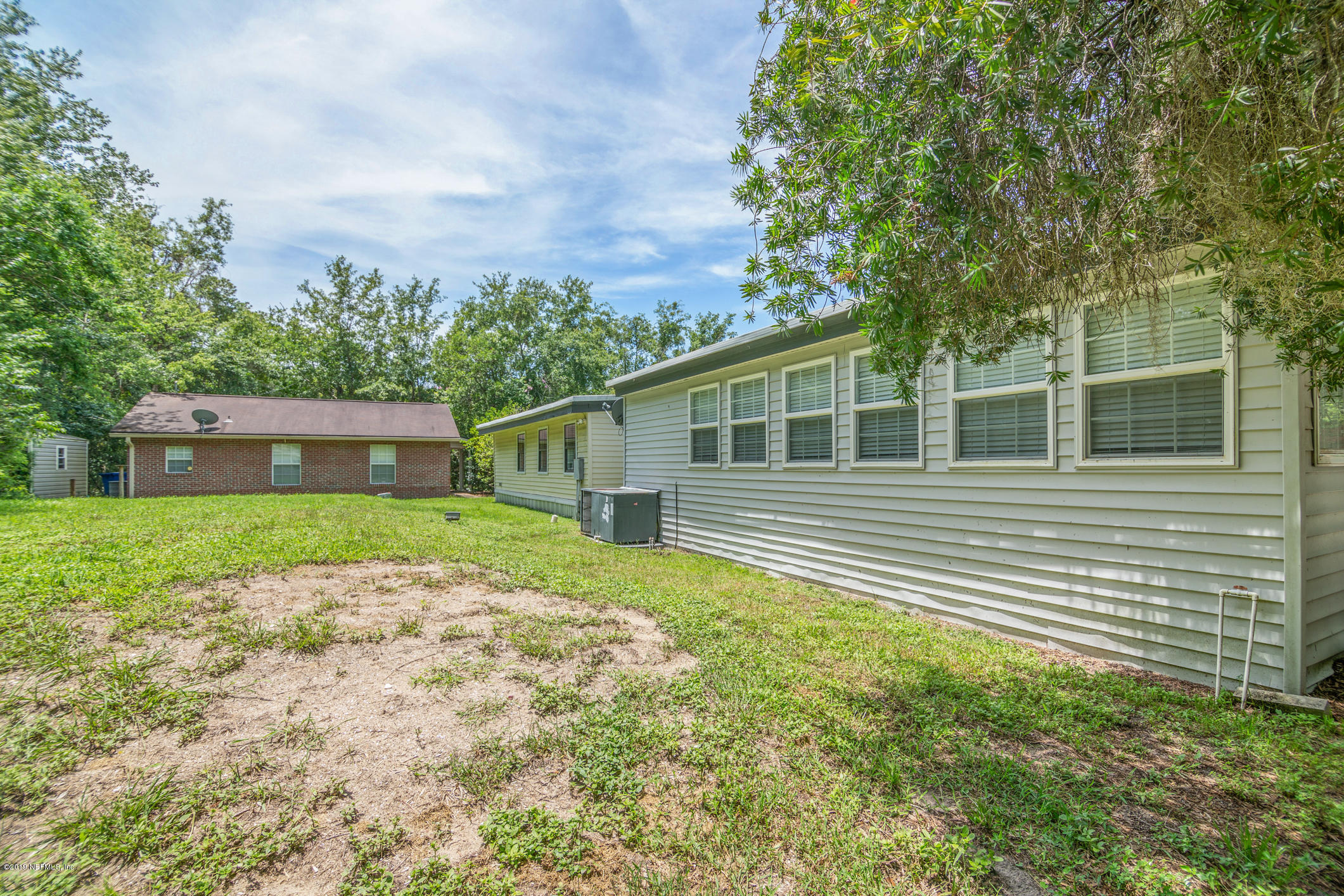 1665 Scott Road St. Johns, FL 32259 - Photo 11 of 54 a backyard of a house with lots of green space