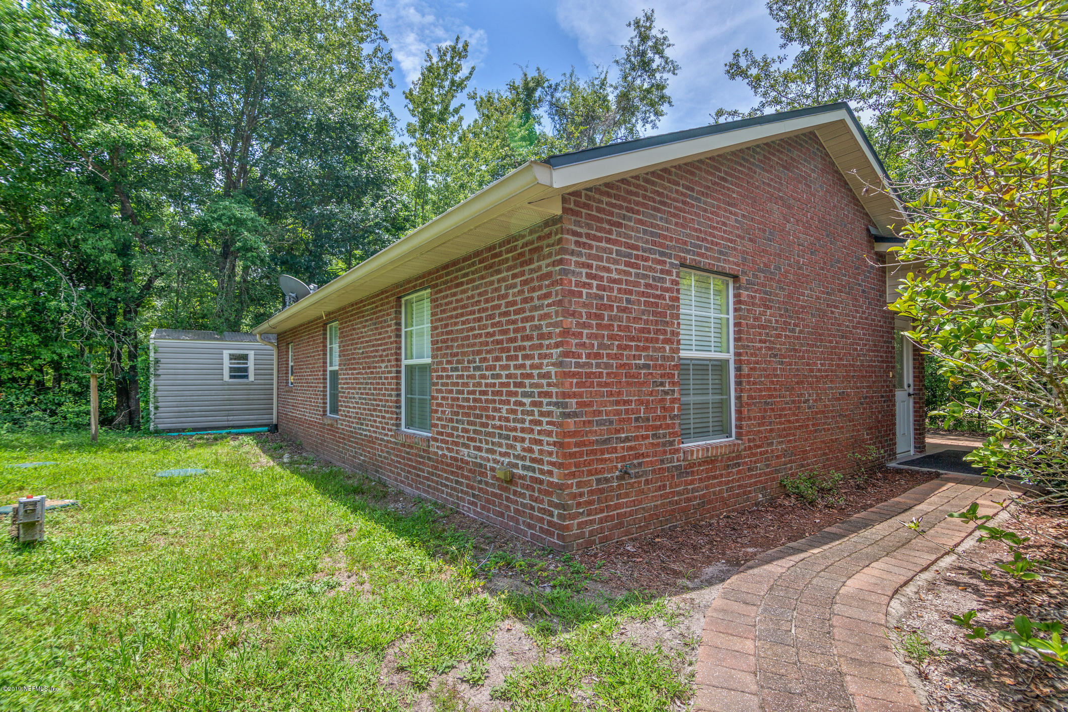 1665 Scott Road St. Johns, FL 32259 - Photo 14 of 54 a backyard of a house with plants and large tree