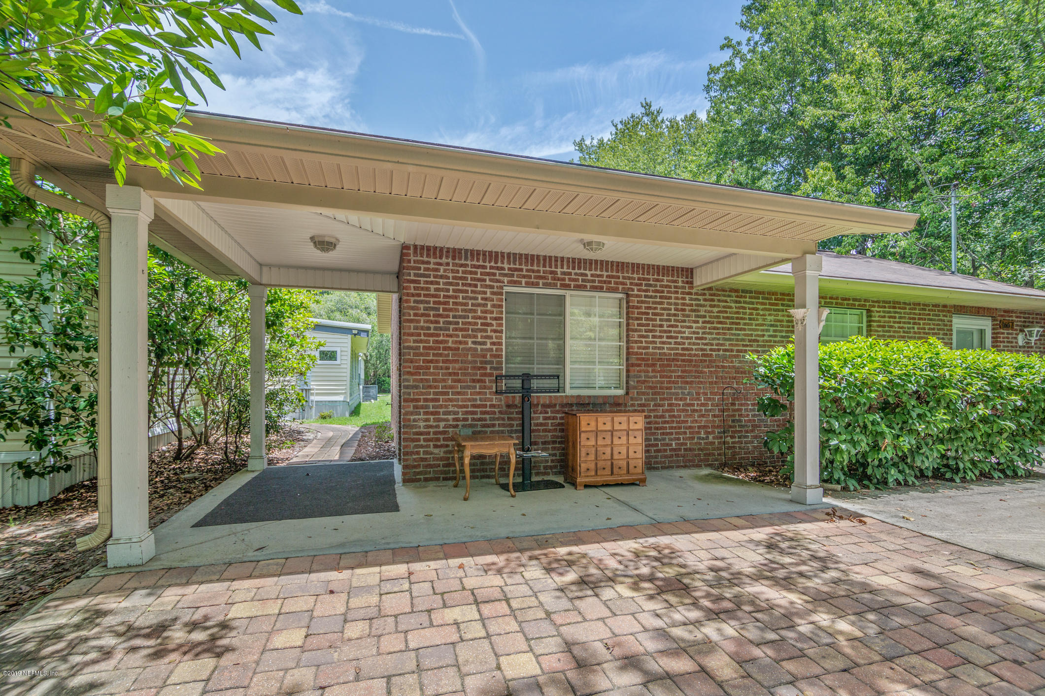 1665 Scott Road St. Johns, FL 32259 - Photo 15 of 54 a view of a patio with table and chairs near a yard