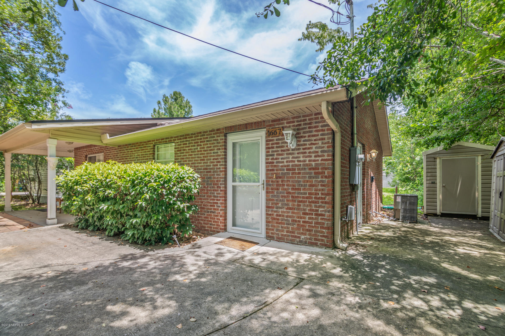 1665 Scott Road St. Johns, FL 32259 - Photo 16 of 54 a front view of a house with garden