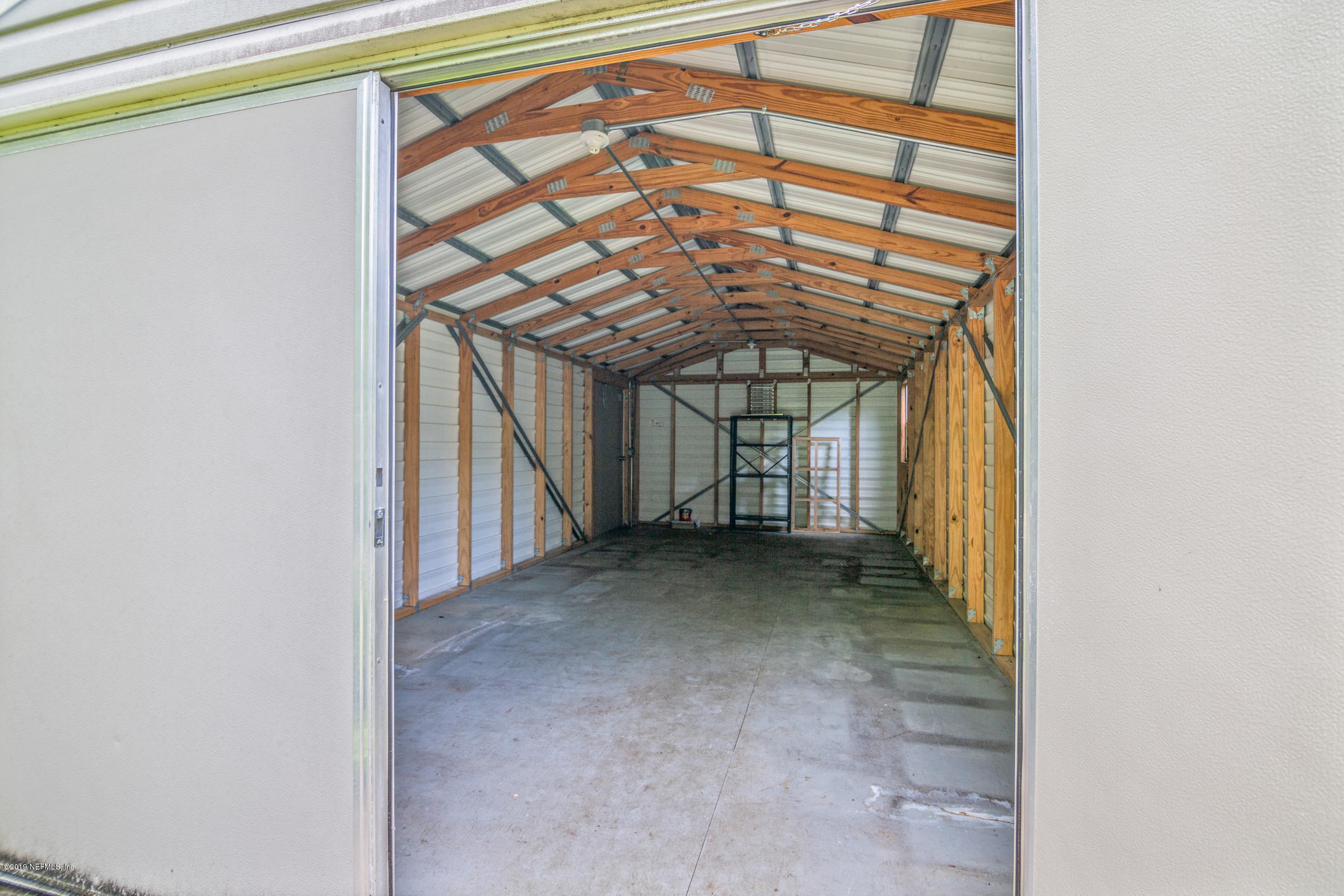 1665 Scott Road St. Johns, FL 32259 - Photo 26 of 54 a view of a room with wooden walls and windows