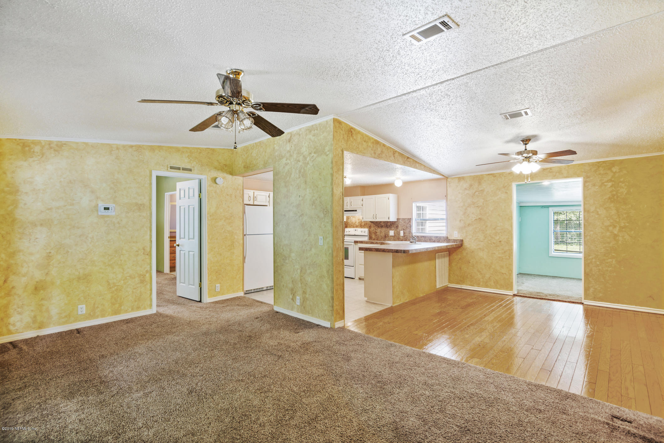 1665 Scott Road St. Johns, FL 32259 - Photo 27 of 54 a view of a kitchen with a sink and a refrigerator