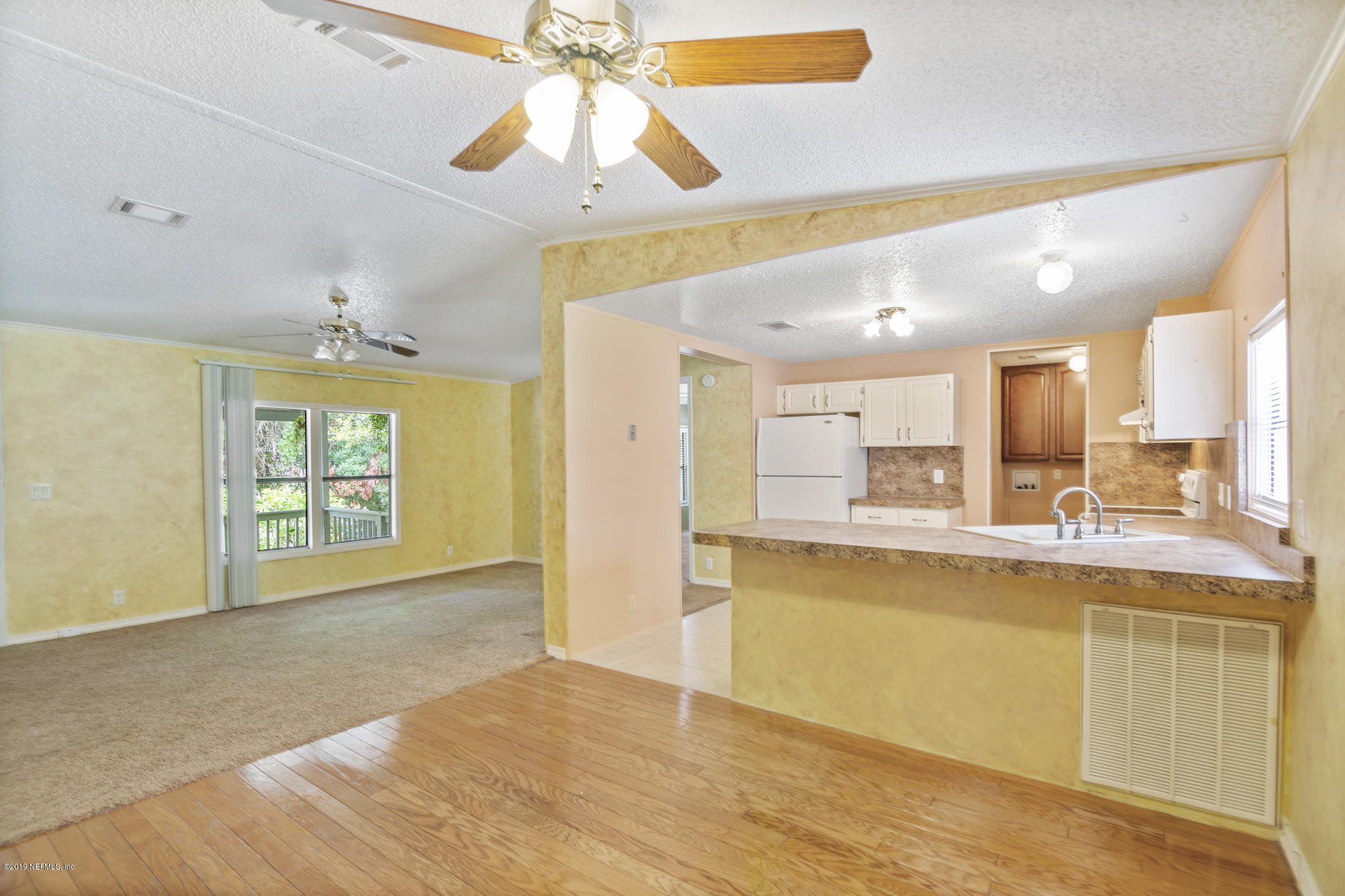 1665 Scott Road St. Johns, FL 32259 - Photo 31 of 54 a large kitchen with a window and a chandelier