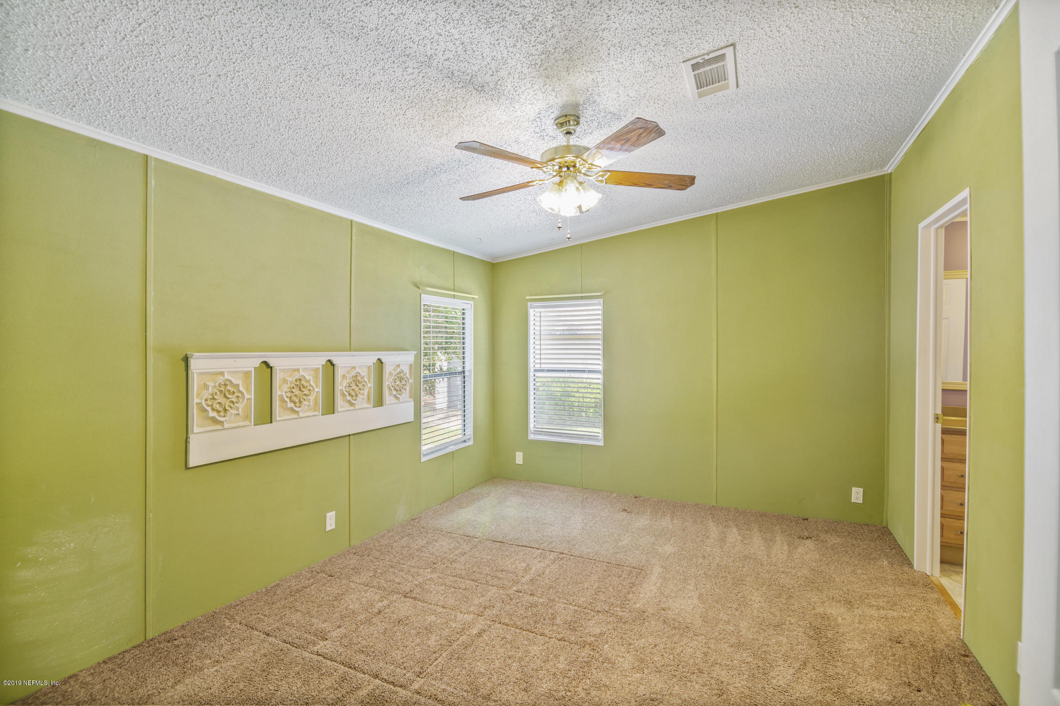 1665 Scott Road St. Johns, FL 32259 - Photo 41 of 54 a view of a room with a window and chandelier fan