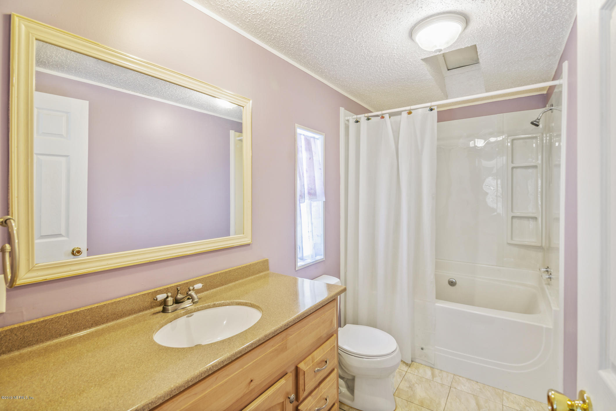 1665 Scott Road St. Johns, FL 32259 - Photo 43 of 54 a bathroom with a sink a toilet and shower