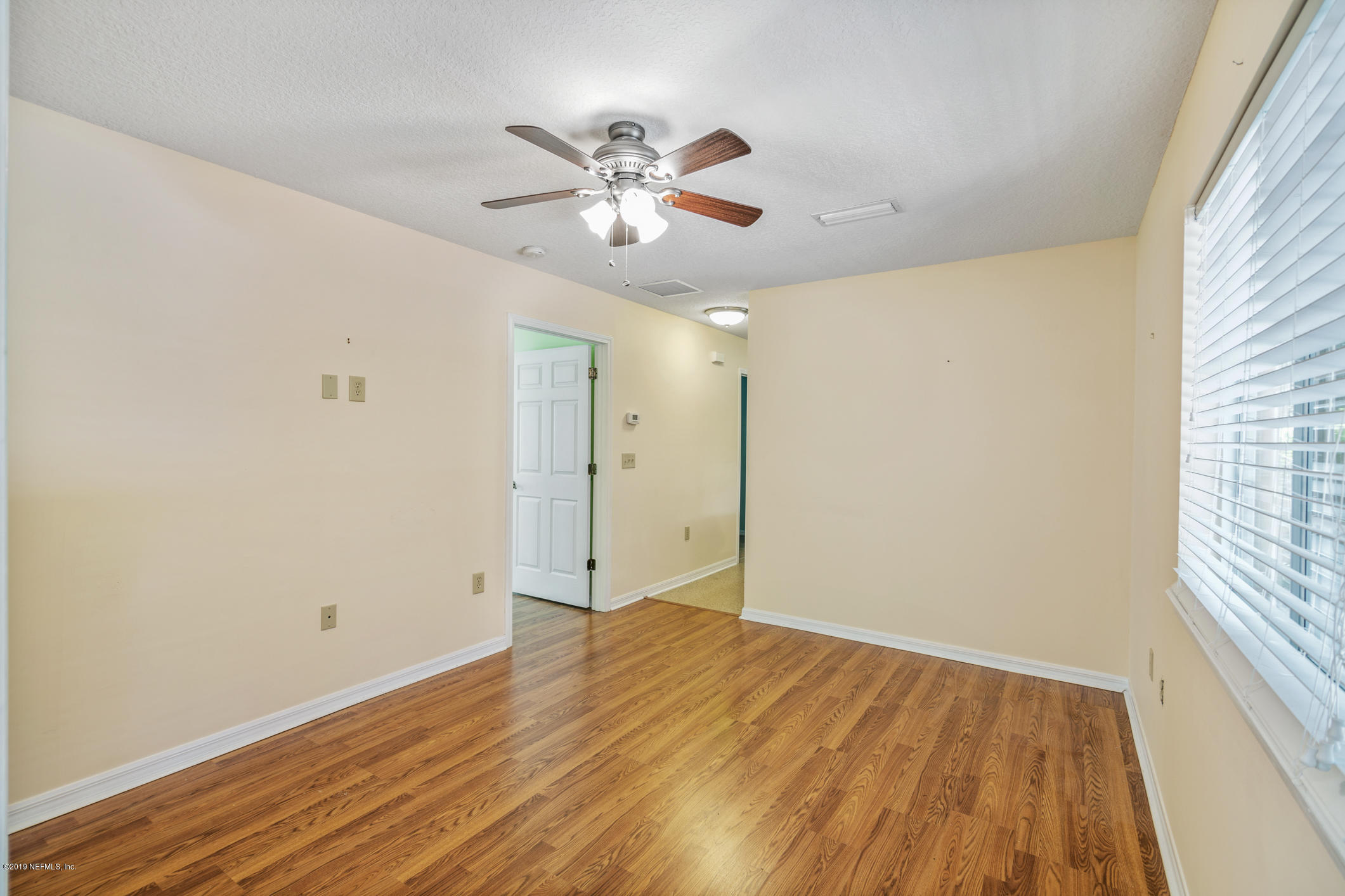 1665 Scott Road St. Johns, FL 32259 - Photo 44 of 54 a view of an empty room with wooden floor and a window