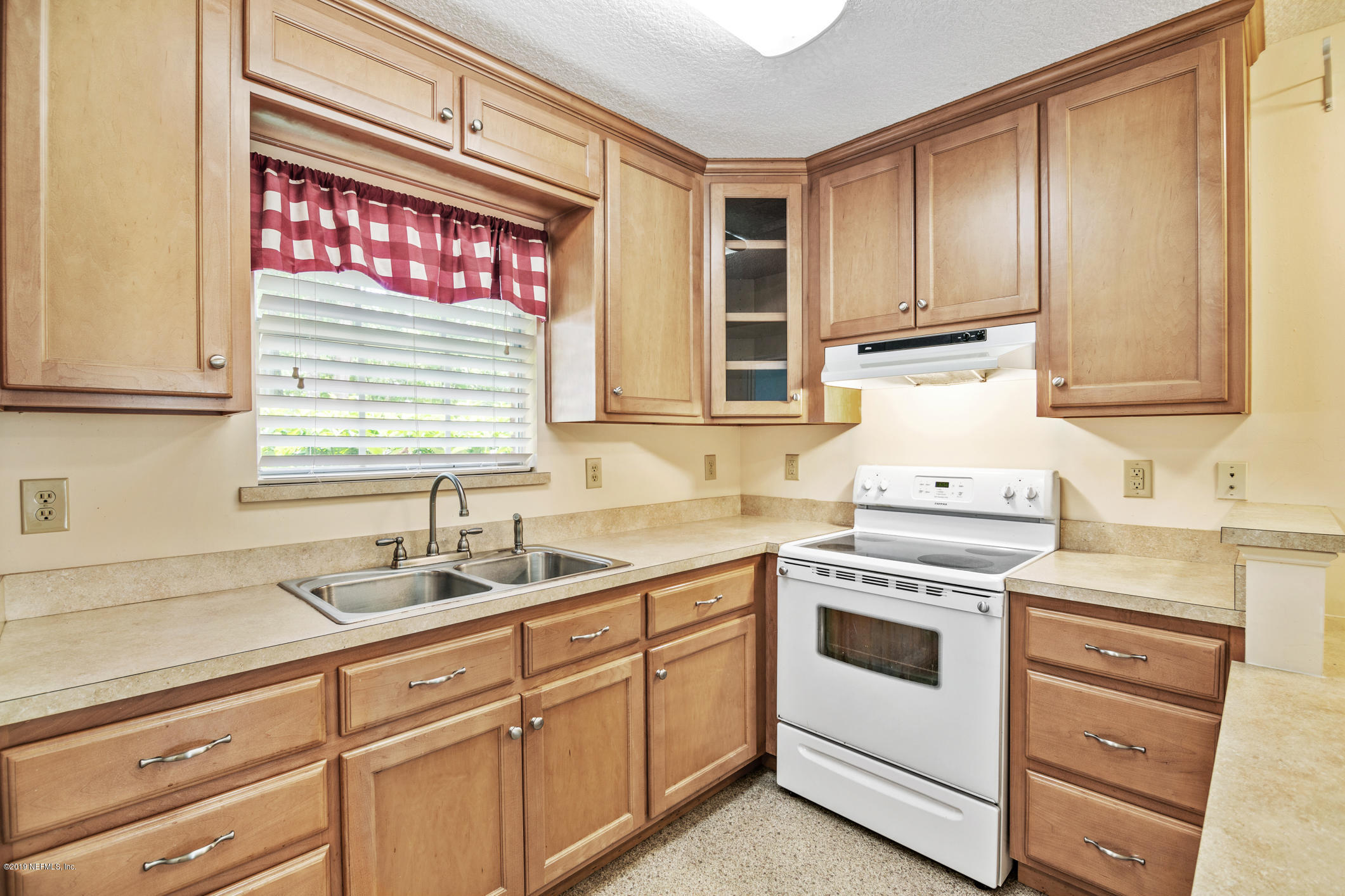 1665 Scott Road St. Johns, FL 32259 - Photo 50 of 54 a kitchen with cabinets appliances a sink and a window