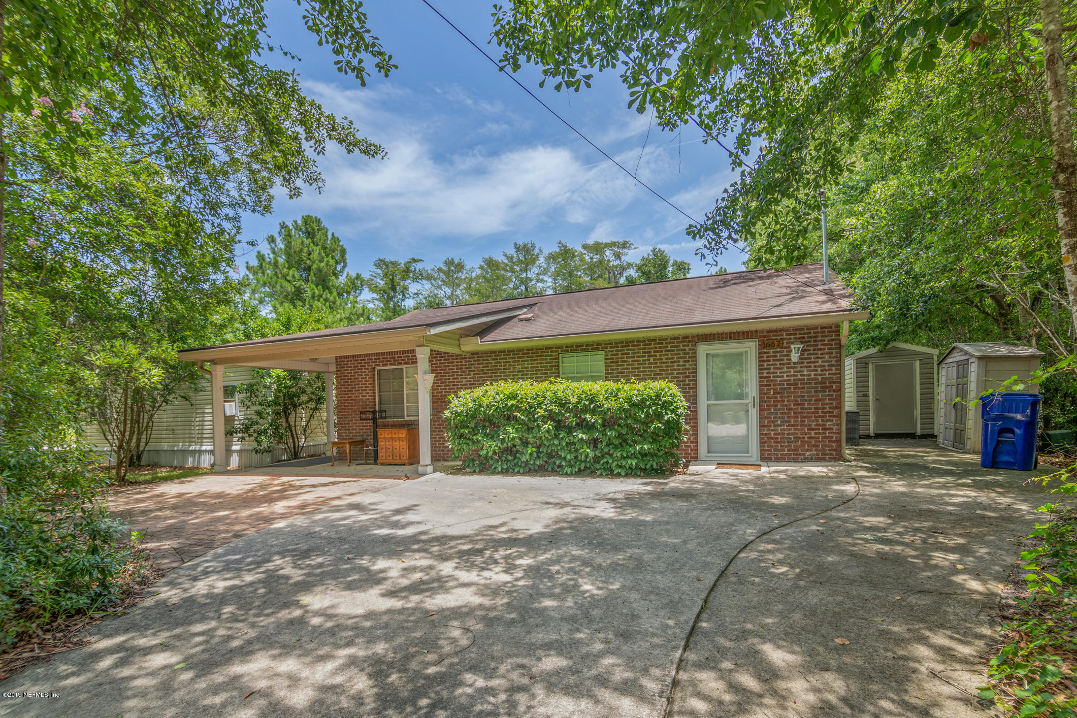1665 Scott Road St. Johns, FL 32259 - Photo 5 of 54 a front view of a house with a yard and potted plants