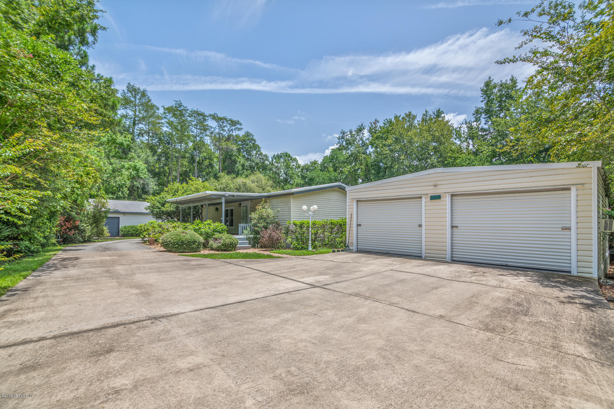 1665 Scott Road St. Johns, FL 32259 - Photo 6 of 54 a view of a house with a yard and garage