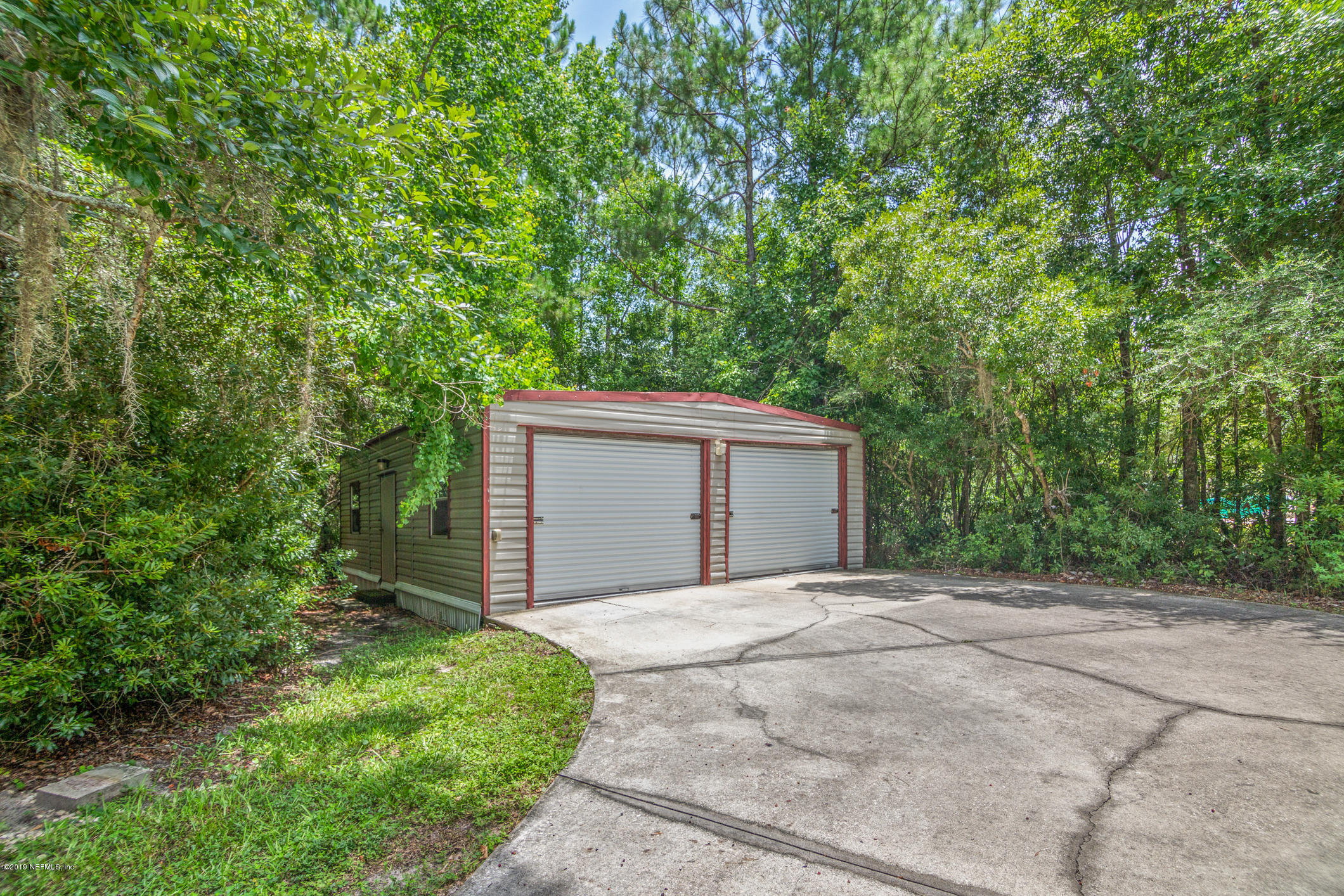 1665 Scott Road St. Johns, FL 32259 - Photo 10 of 54 a backyard of a house with large trees