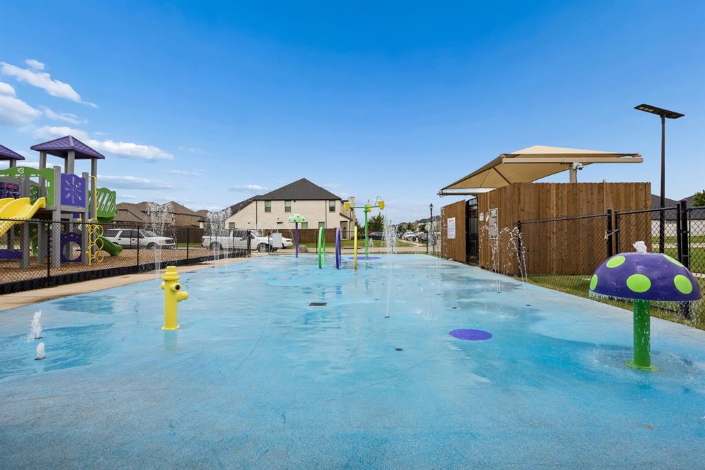 638 Hazeltine Road Red Oak, TX 75154 - Photo 25 of 29 a view of a swimming pool with a bench