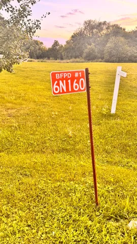a view of a swimming pool with a yard
