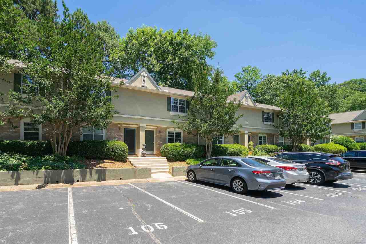 6900 Roswell Road, Unit I4 Atlanta, GA 30328 - Photo 1 of 1 a car parked in front of a house