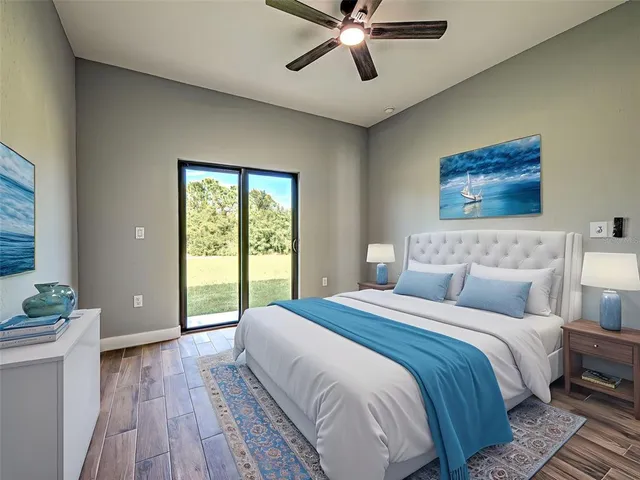 a bedroom with a large bed and a window