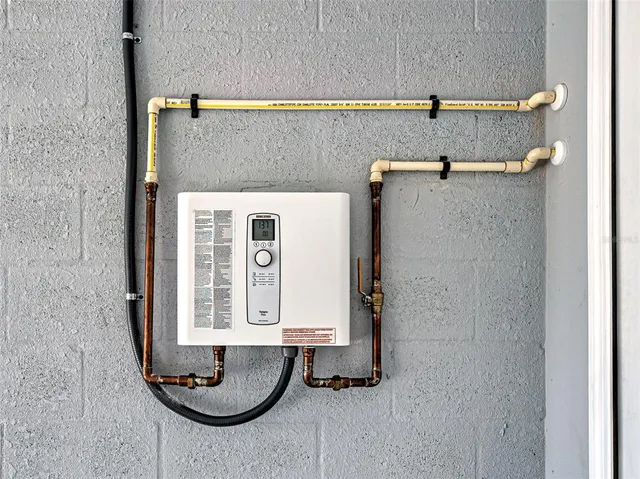 a bathroom with a granite countertop shower and a sink