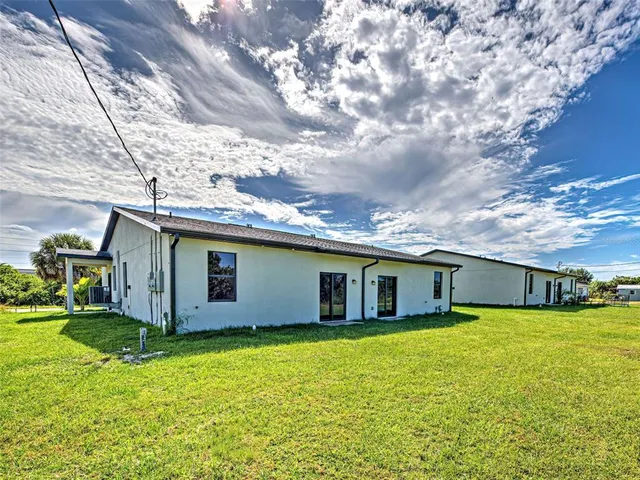a view of a house with a big yard