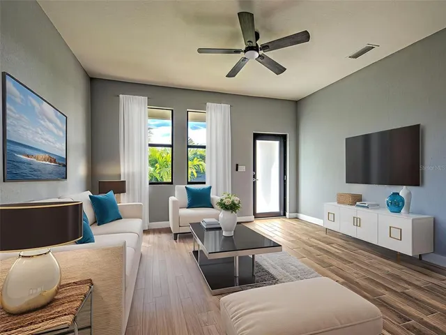 a living room with furniture and a flat screen tv