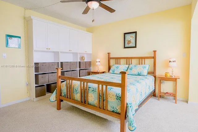 a bed room with a bed and a lamp