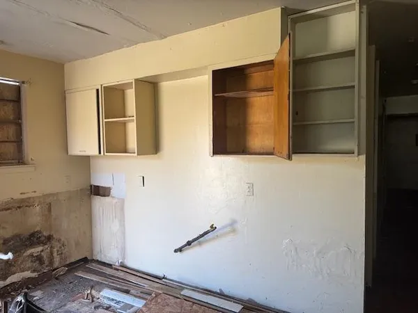 a bathroom with a shower and a sink