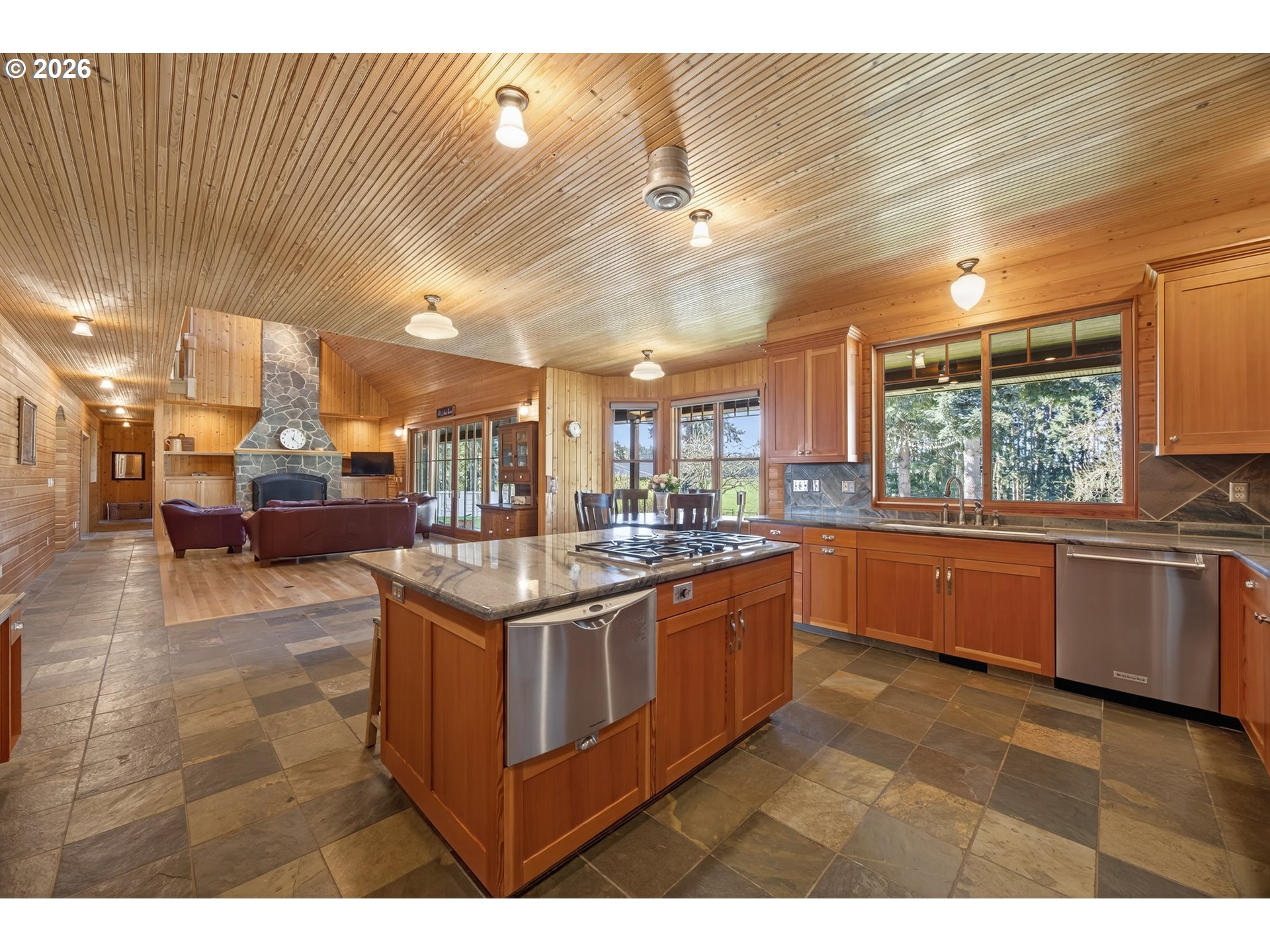 17765 Monnier Road Northeast Hubbard, OR 97032 - Photo 15 of 48 a kitchen with stainless steel appliances granite countertop a sink and a stove
