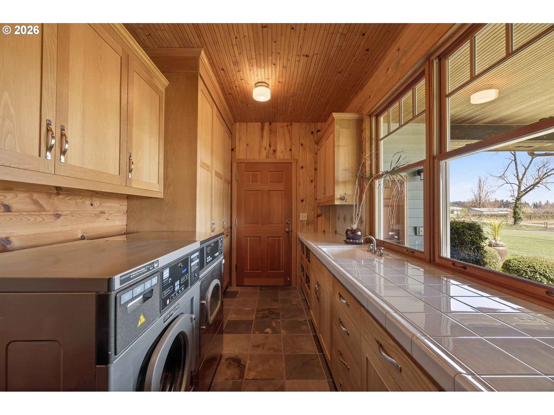 17765 Monnier Road Northeast Hubbard, OR 97032 - Photo 17 of 48 a kitchen with a sink a counter top space and stainless steel appliances