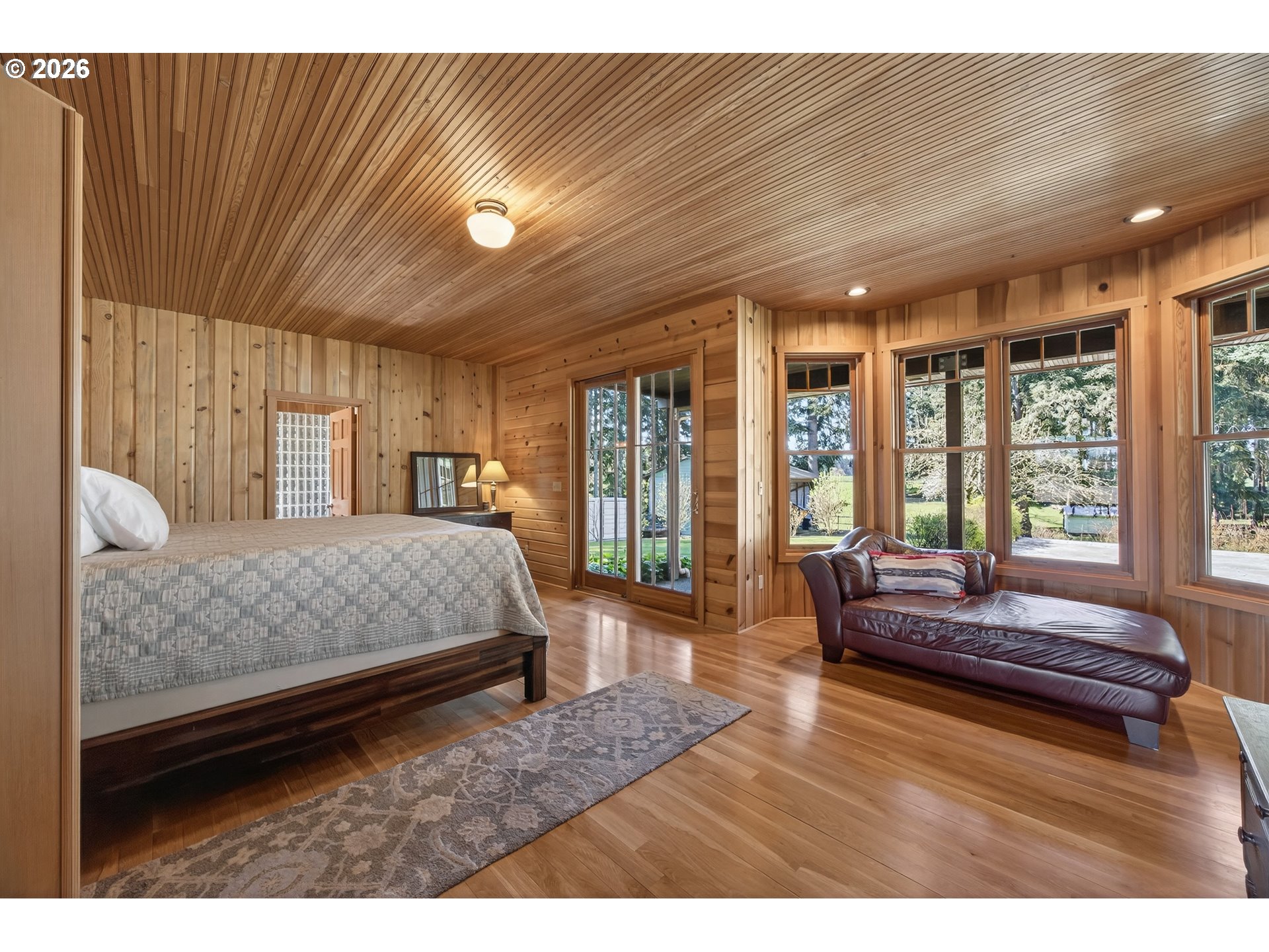 17765 Monnier Road Northeast Hubbard, OR 97032 - Photo 18 of 48 a bedroom with a large bed and a couch