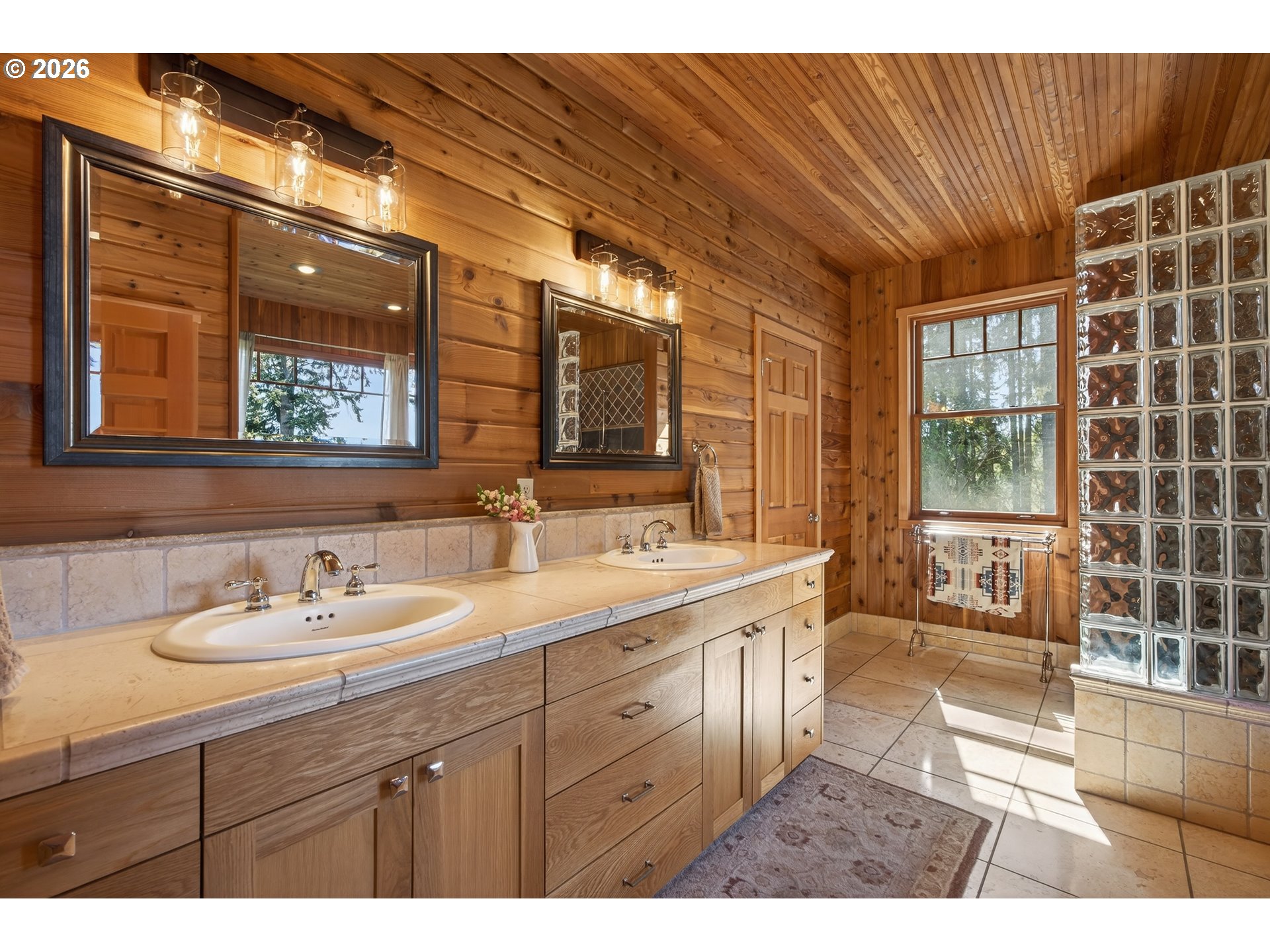 17765 Monnier Road Northeast Hubbard, OR 97032 - Photo 19 of 48 a spacious bathroom with a double vanity sink a mirror and a shower
