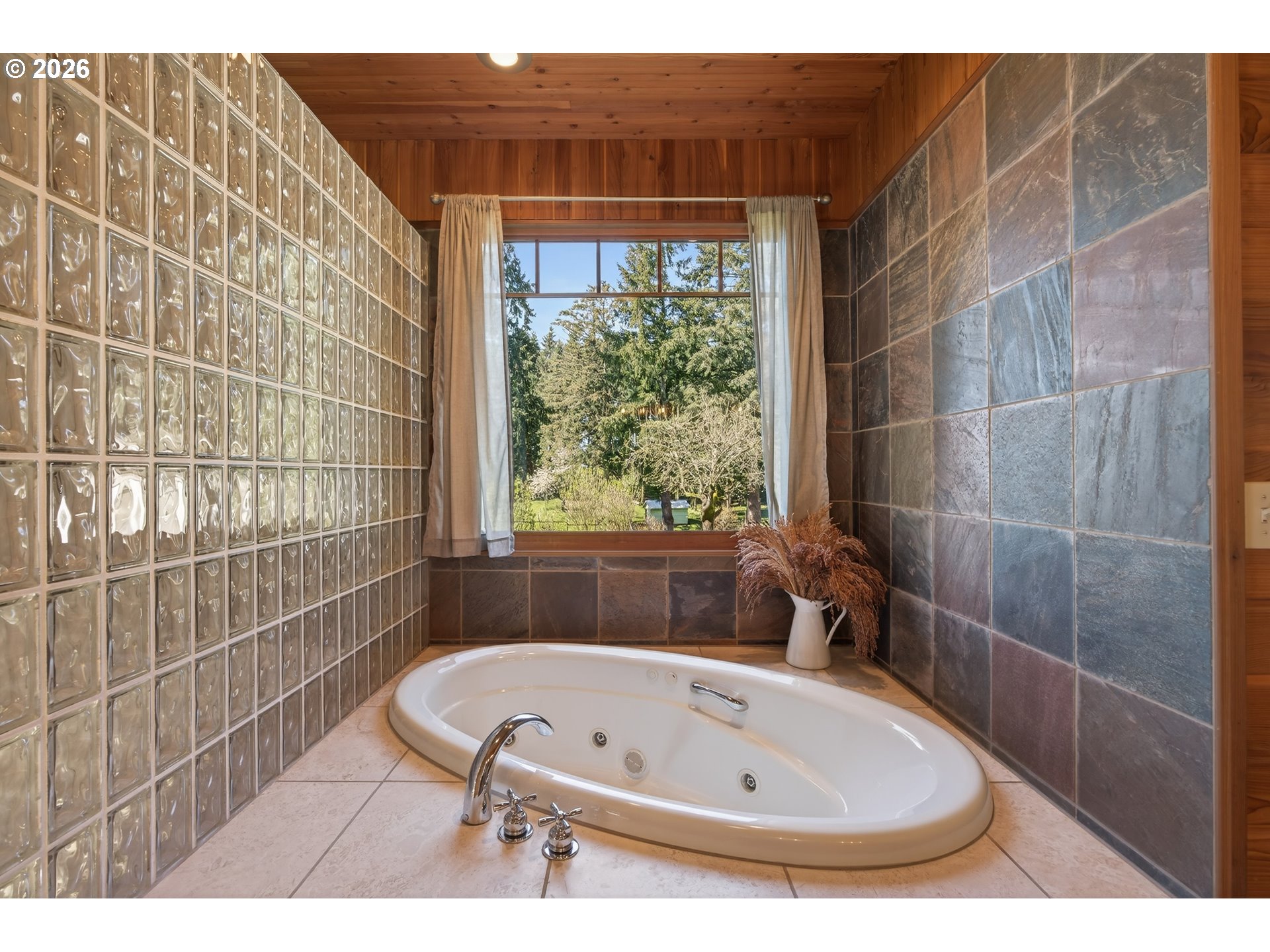 17765 Monnier Road Northeast Hubbard, OR 97032 - Photo 20 of 48 a bathroom with a tub and window