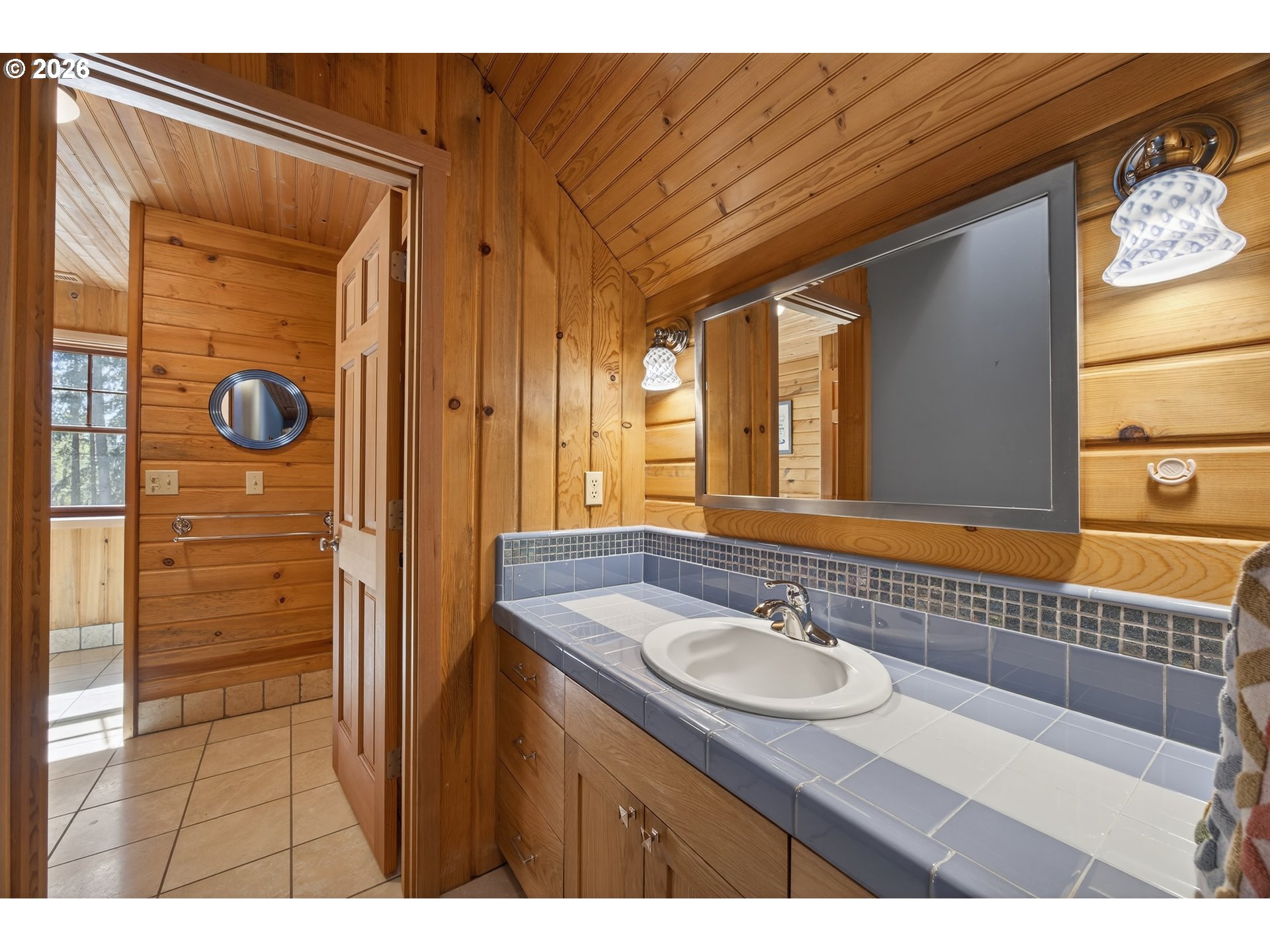 17765 Monnier Road Northeast Hubbard, OR 97032 - Photo 26 of 48 a bathroom with a sink a mirror and a shower