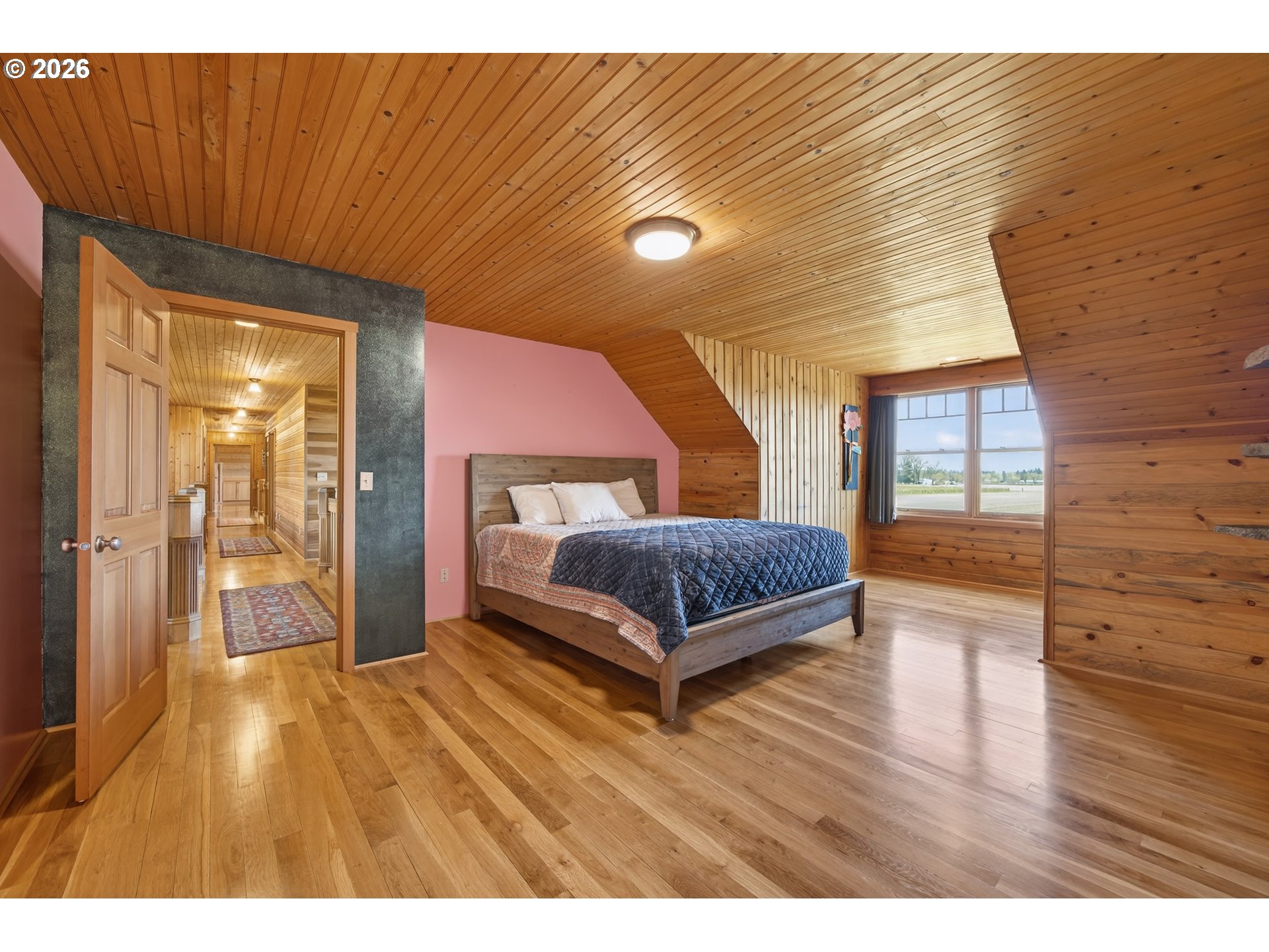 17765 Monnier Road Northeast Hubbard, OR 97032 - Photo 29 of 48 a bedroom with a bed and wooden floor
