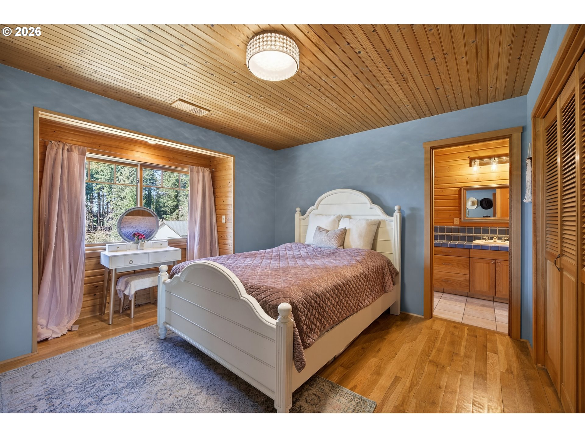 17765 Monnier Road Northeast Hubbard, OR 97032 - Photo 31 of 48 a bedroom with a bed and a large window