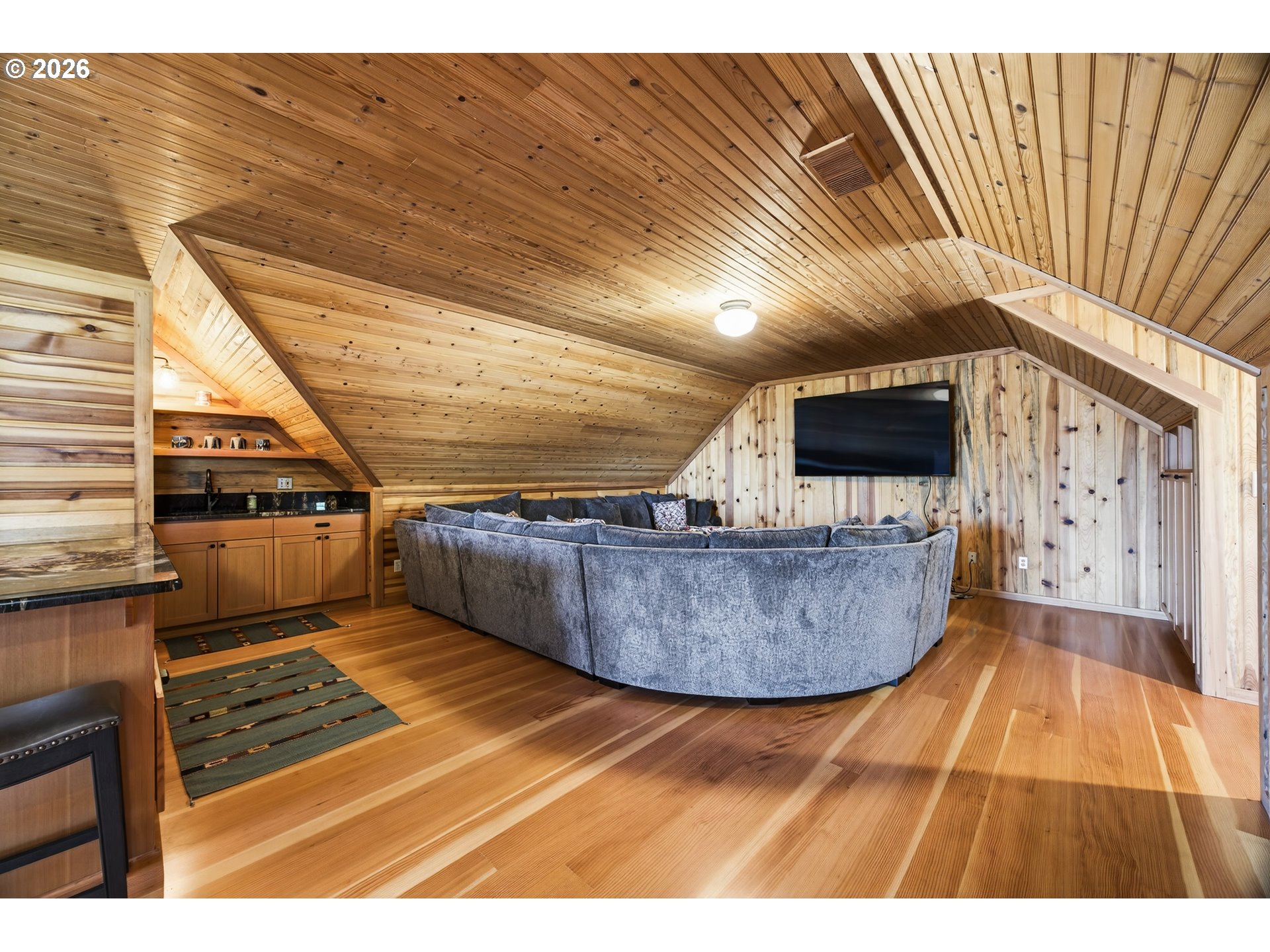 17765 Monnier Road Northeast Hubbard, OR 97032 - Photo 36 of 48 a living room with a flat screen tv and fireplace