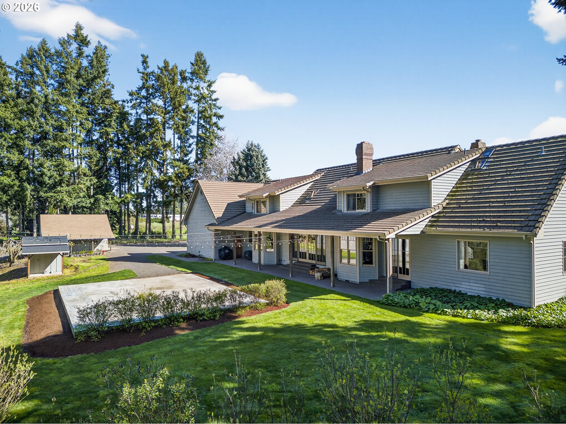 17765 Monnier Road Northeast Hubbard, OR 97032 - Photo 37 of 48 a front view of a house with garden