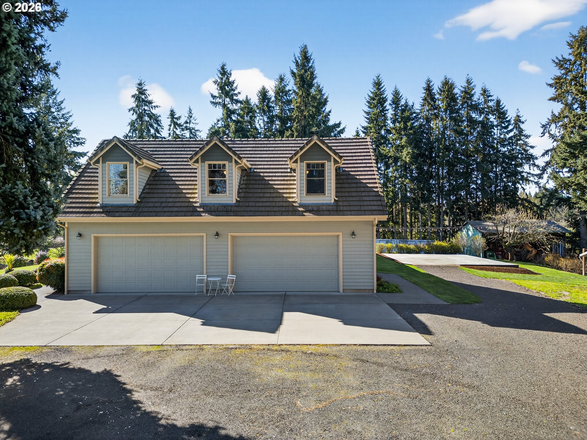 17765 Monnier Road Northeast Hubbard, OR 97032 - Photo 38 of 48 a front view of a house with a yard and garage
