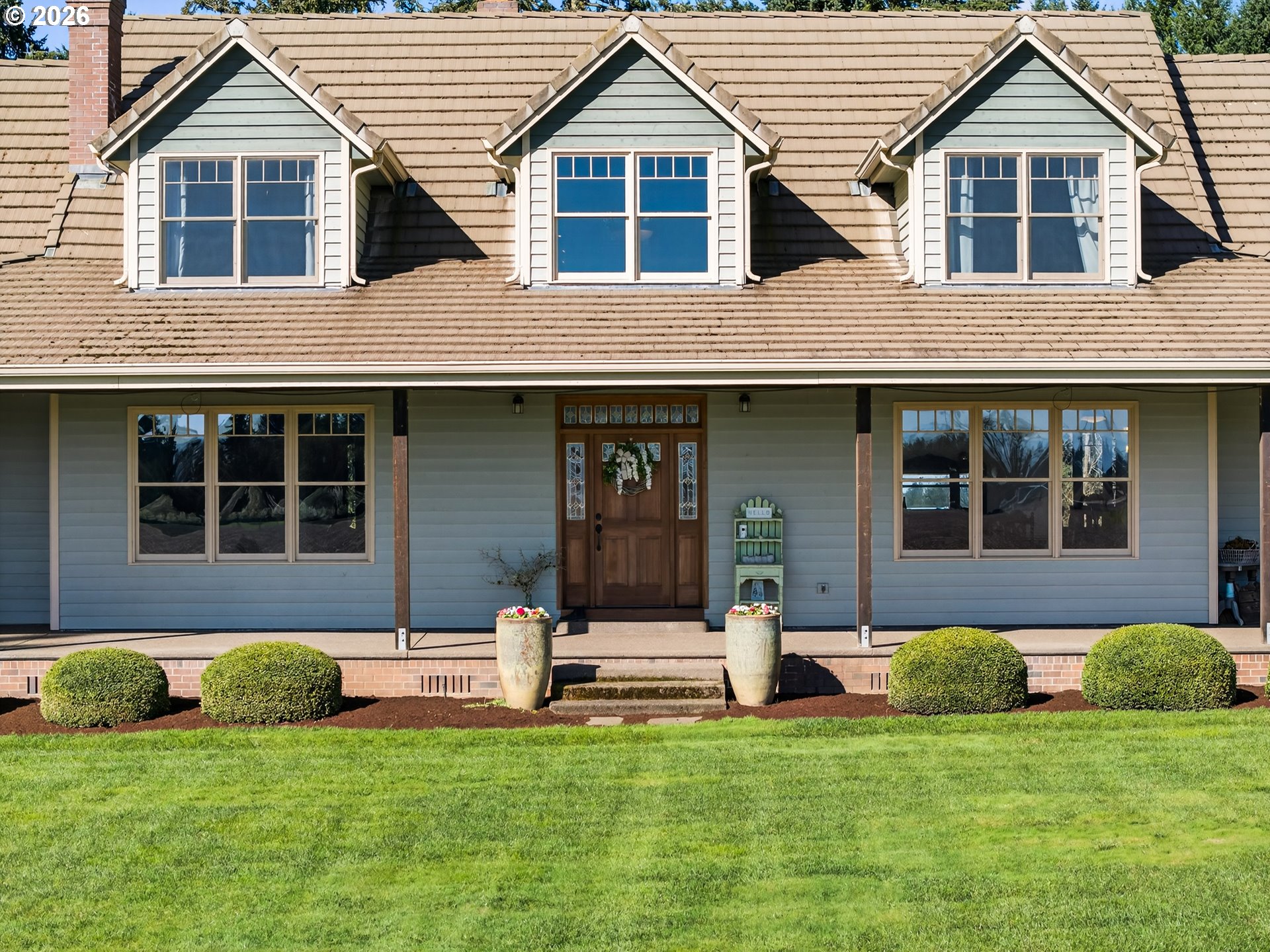 17765 Monnier Road Northeast Hubbard, OR 97032 - Photo 4 of 48 a front view of a house with a yard