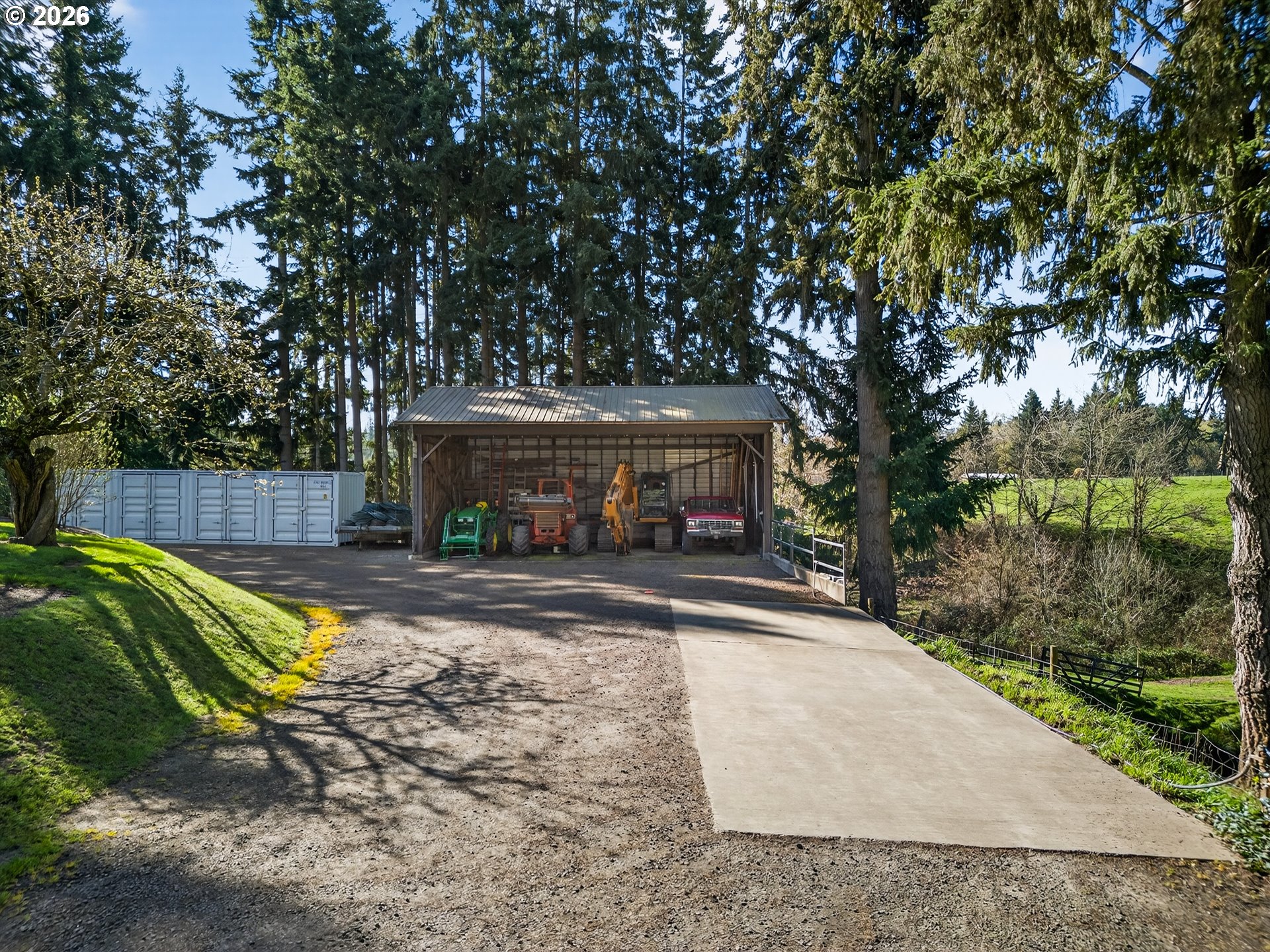 17765 Monnier Road Northeast Hubbard, OR 97032 - Photo 43 of 48 a view of a patio with table and chairs with wooden fence and plants