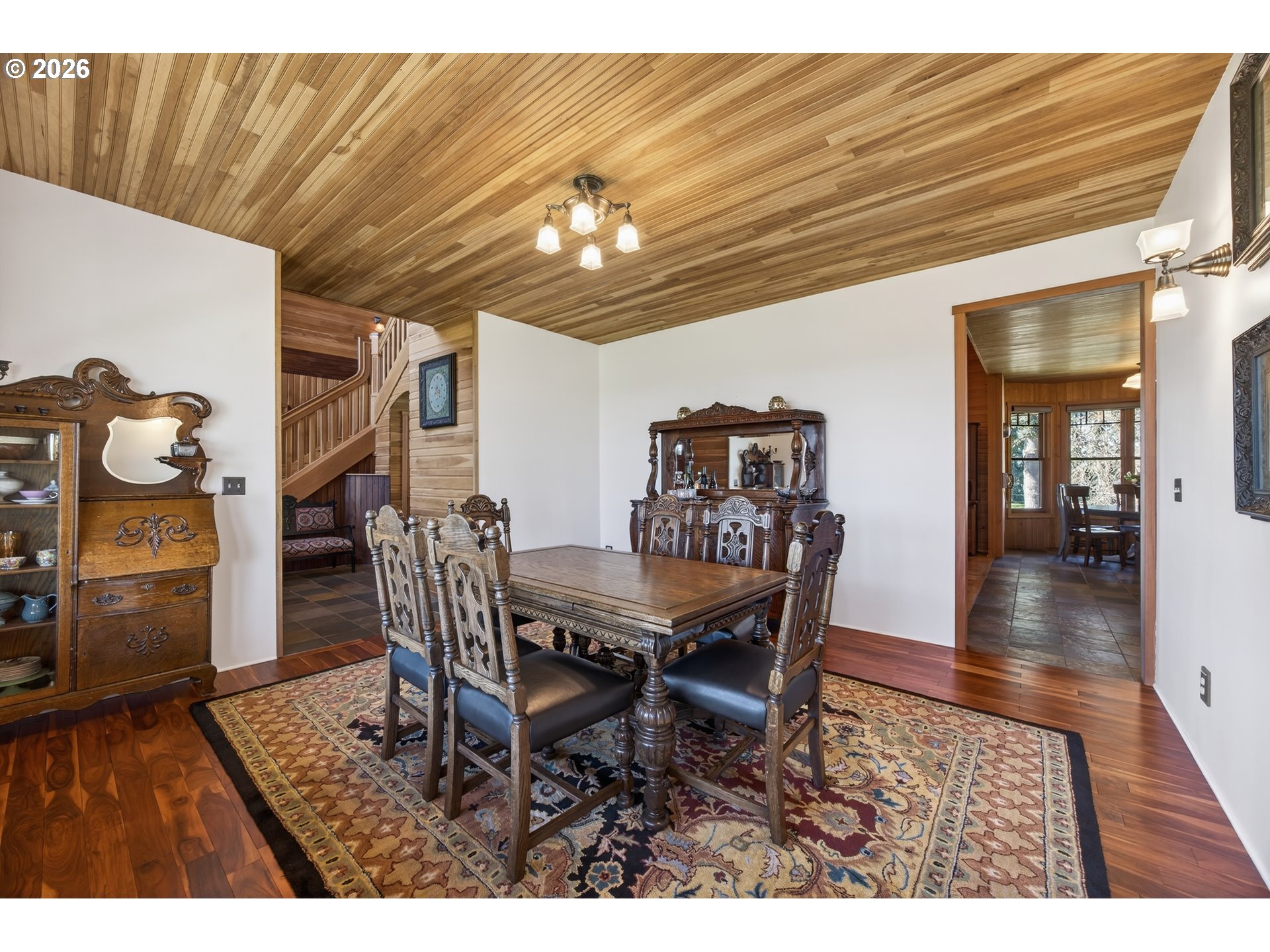 17765 Monnier Road Northeast Hubbard, OR 97032 - Photo 7 of 48 a dining room with furniture and chandelier
