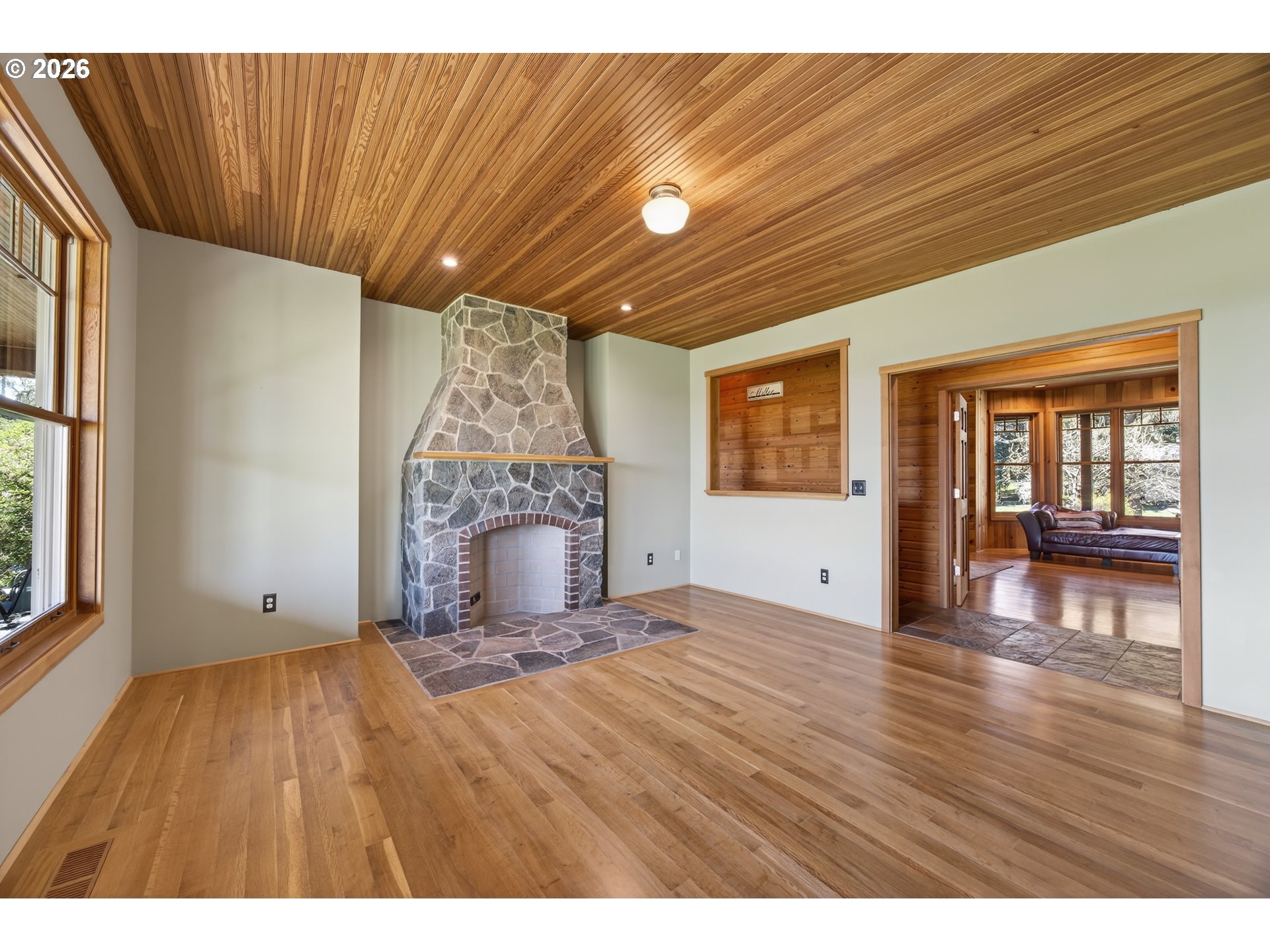 17765 Monnier Road Northeast Hubbard, OR 97032 - Photo 8 of 48 a view of an empty room with wooden floor and a window