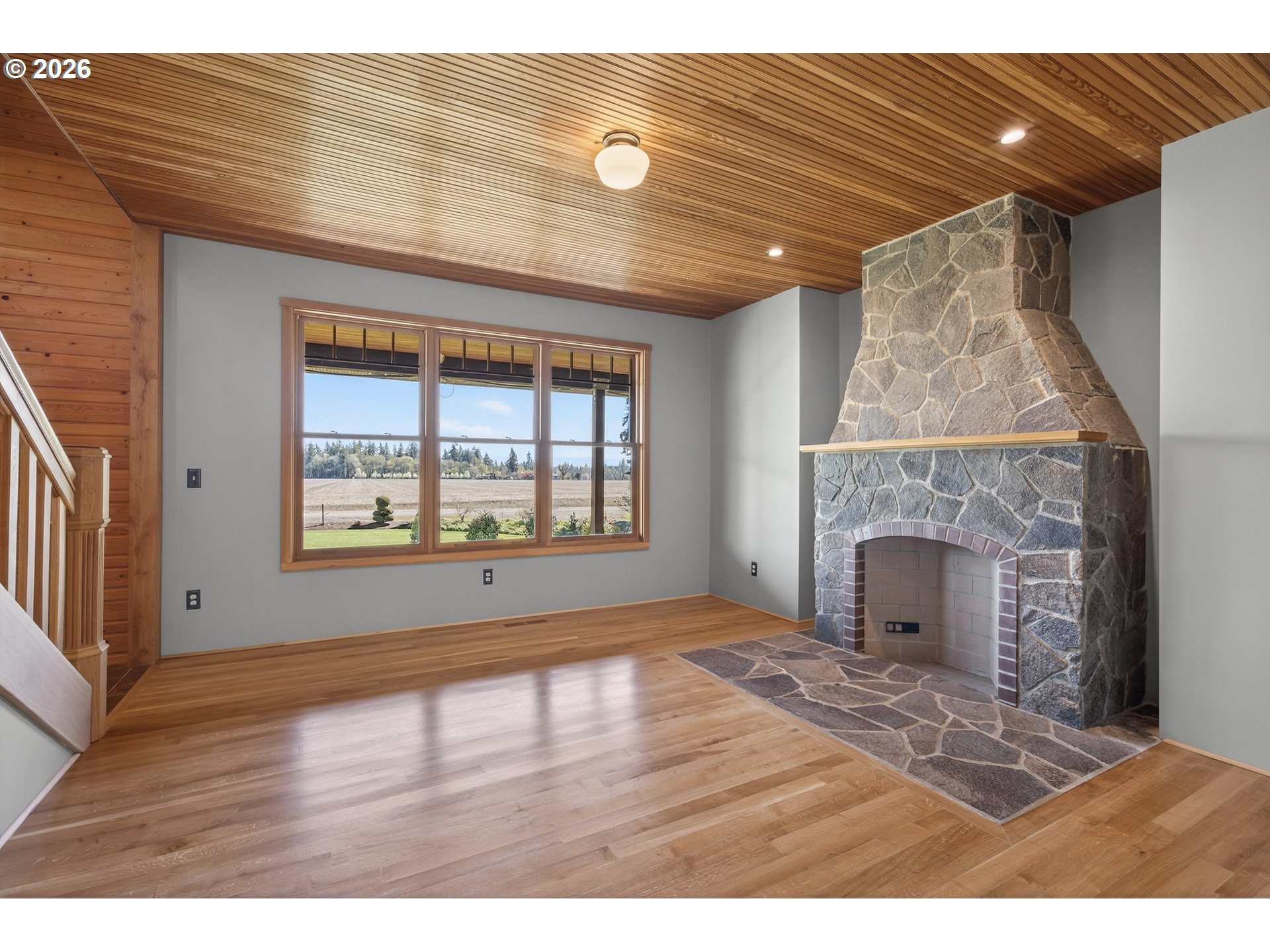 17765 Monnier Road Northeast Hubbard, OR 97032 - Photo 9 of 48 a view of an empty room with wooden floor and a window