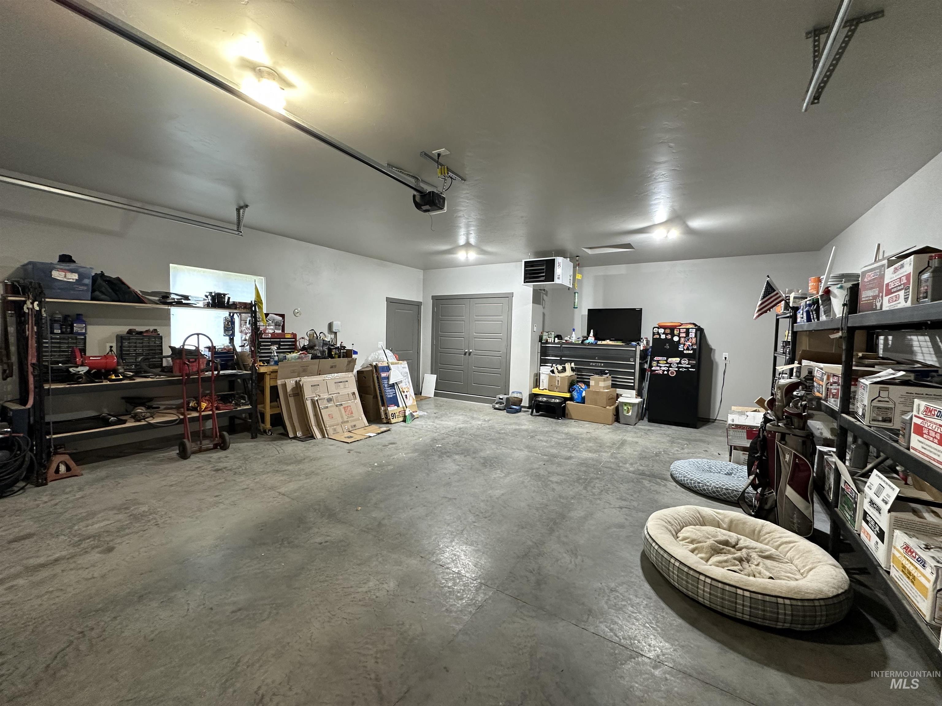 225 Slate Springs Kimberly, ID 83341 - Photo 29 of 45 Garage featuring a heating unit and a workshop area