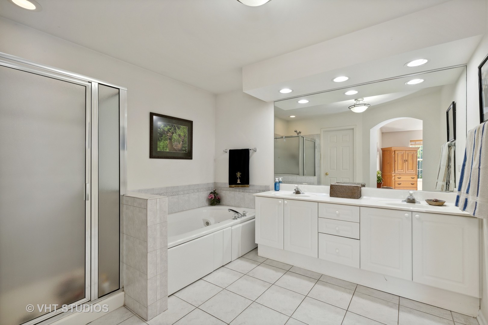 6265 Murifield Drive Gurnee, IL 60031 - Photo 13 of 30 a large white bathroom with a sink a mirror and a bathtub