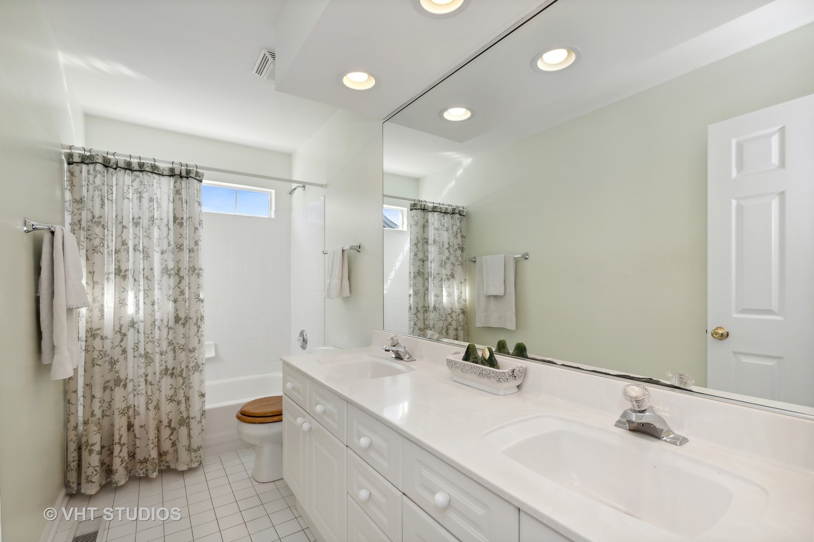 6265 Murifield Drive Gurnee, IL 60031 - Photo 17 of 30 a bathroom with double vanity sink and shower