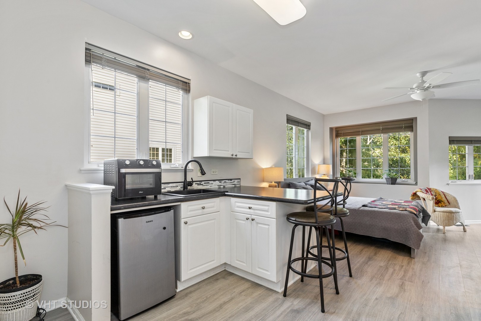 6265 Murifield Drive Gurnee, IL 60031 - Photo 26 of 30 a kitchen with a sink stove and cabinets